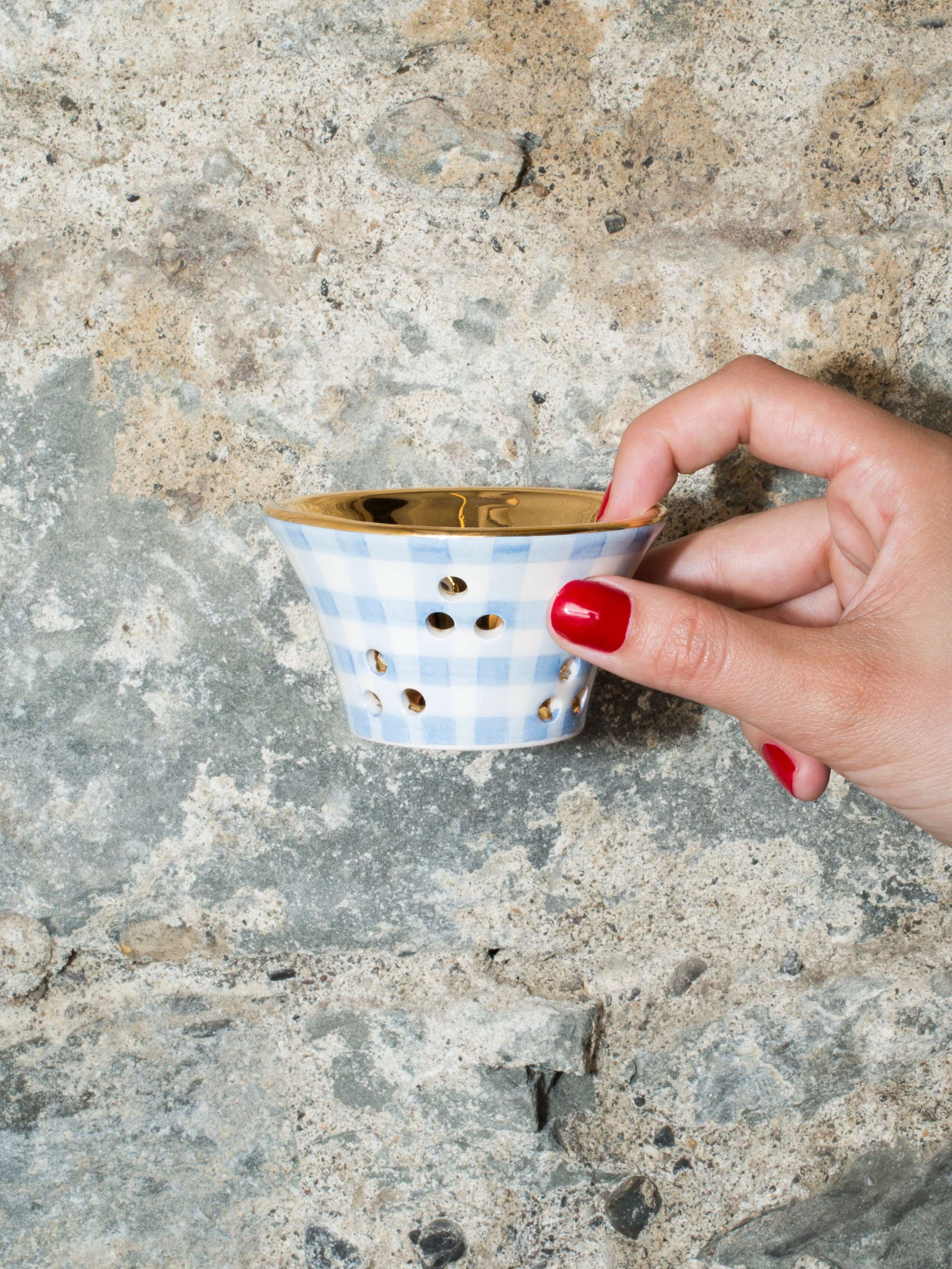 person holding tealight
