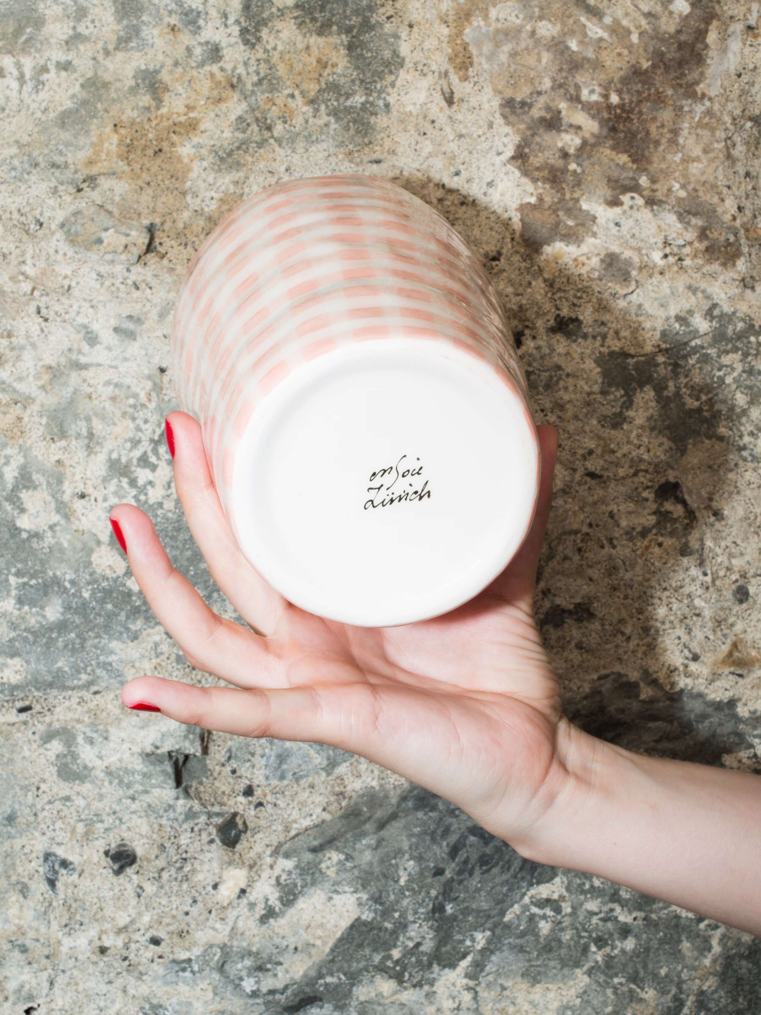 person holding vase 