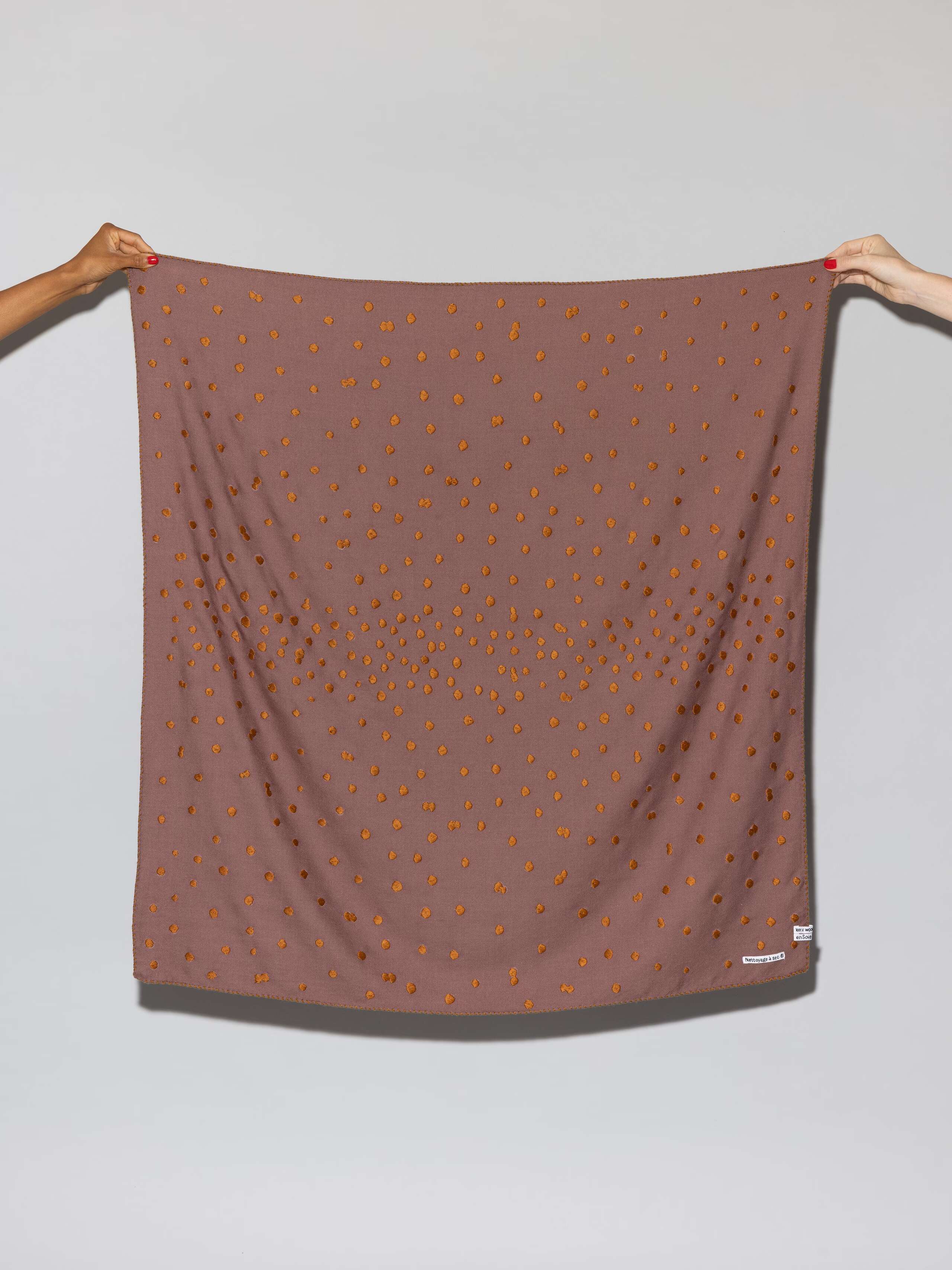 Leo wool scarf in a warm cherry wood purple with dot embroidery in warm bronze shades