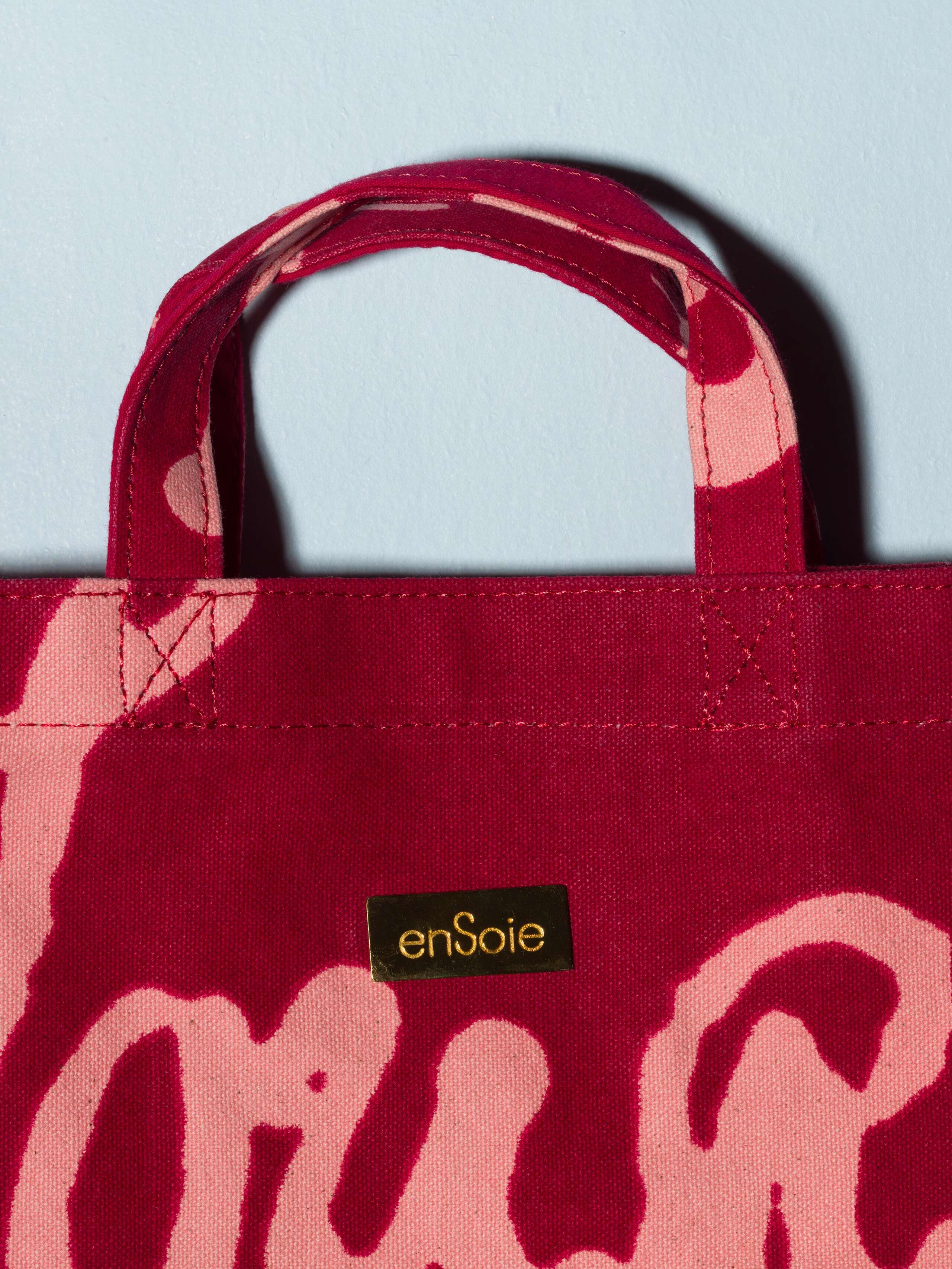canvas shopper bag model cabas proverb print red with pink text details brass small