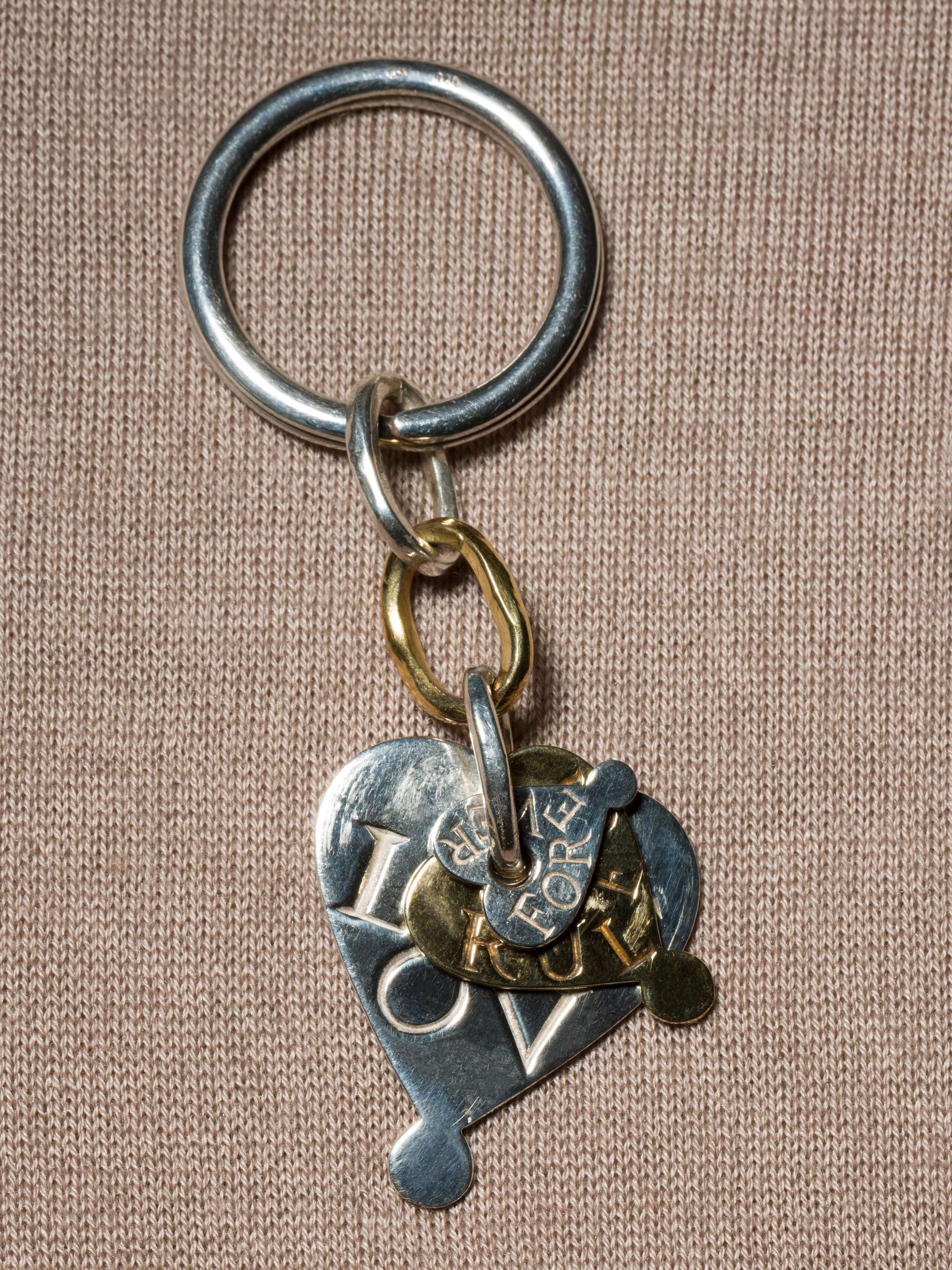 keychain with engraved heart pendents in silver and brass packshot