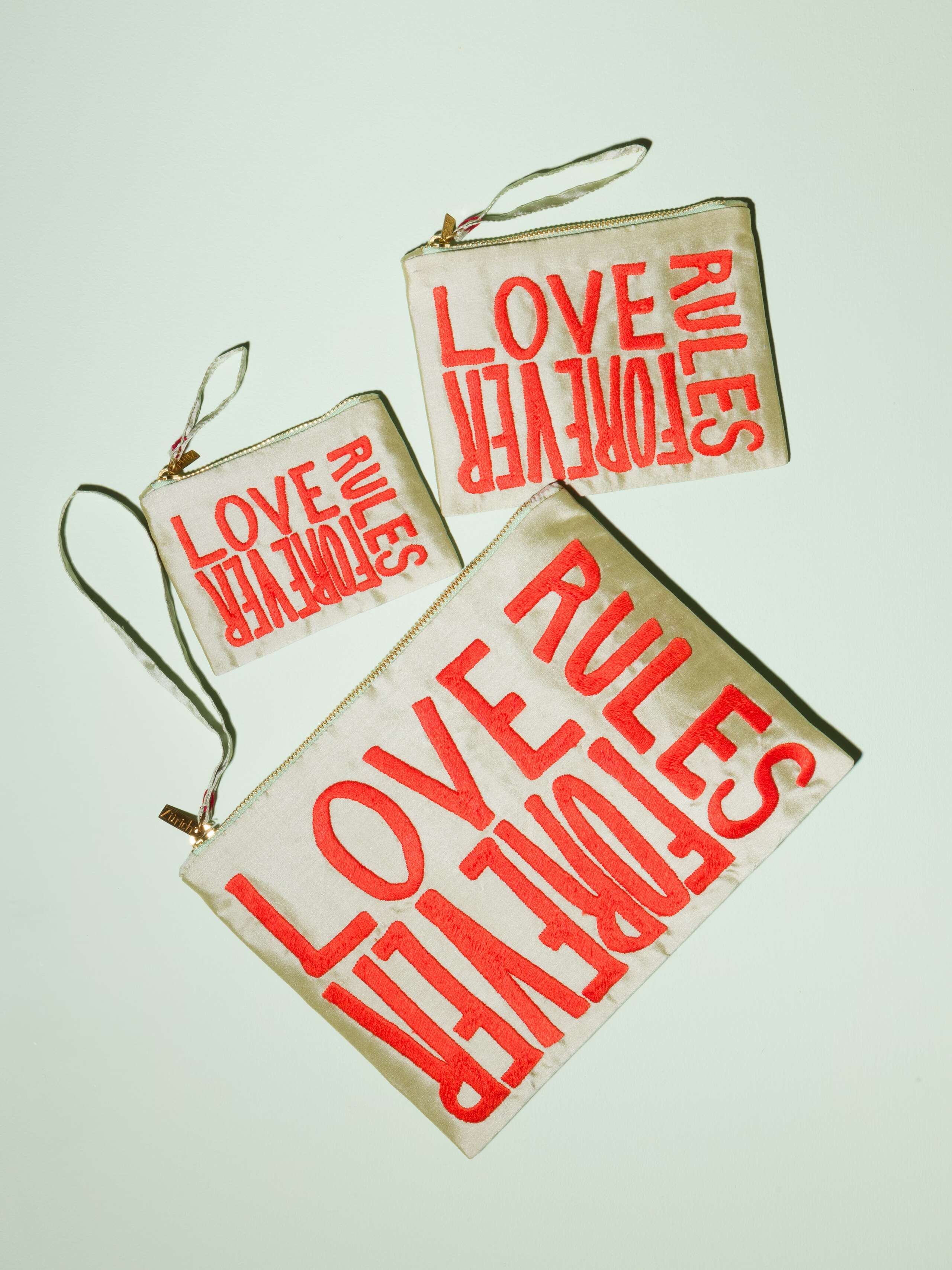 Beautiful silk clutch, Love rules forever embroidery enSoie embroidery, red embroidery on glossy pistache silk
