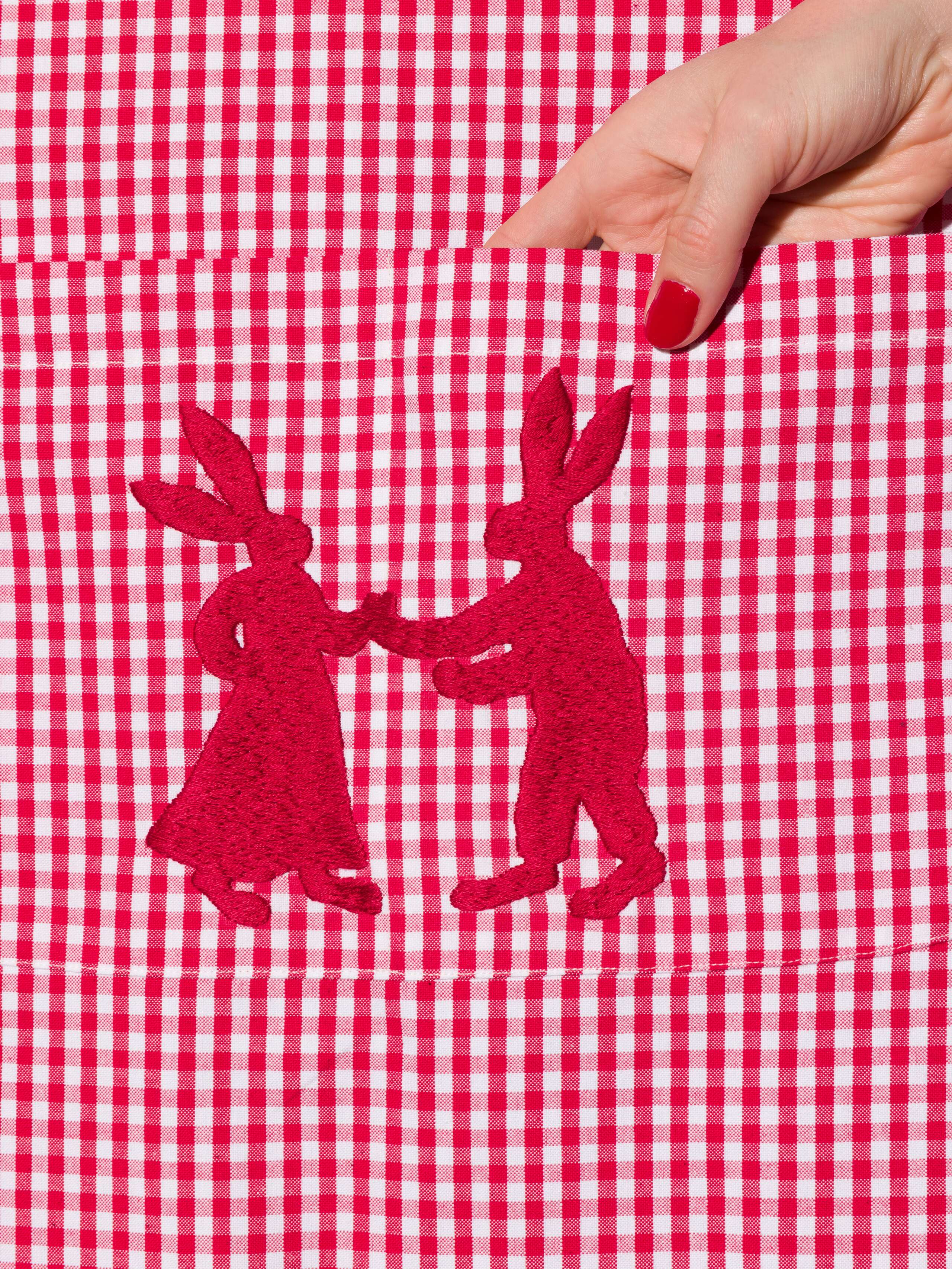 Vichy cotton apron with hand embroidery of dancing rabbits in red