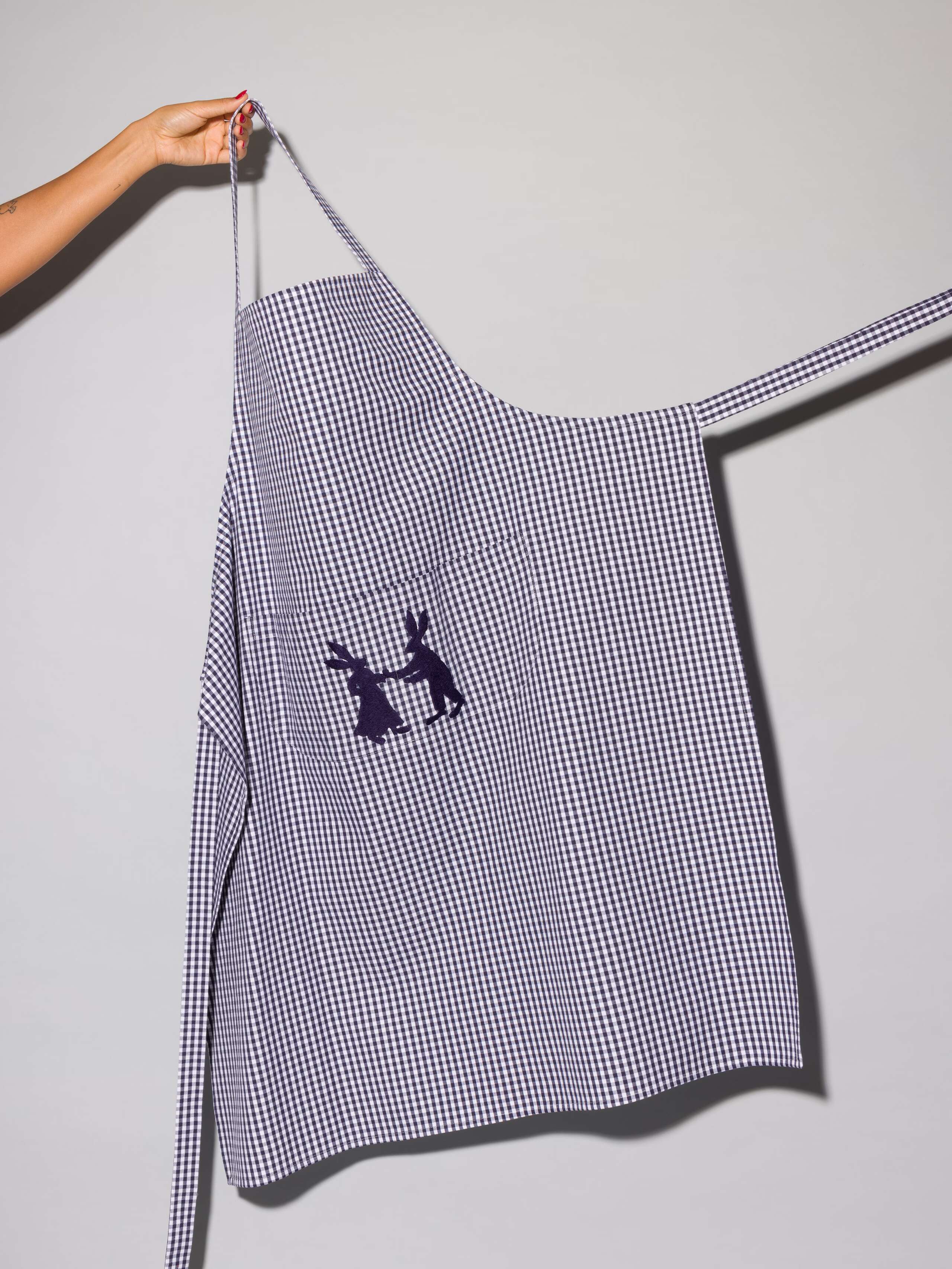 Vichy cotton apron with hand embroidery of dancing rabbits in navy