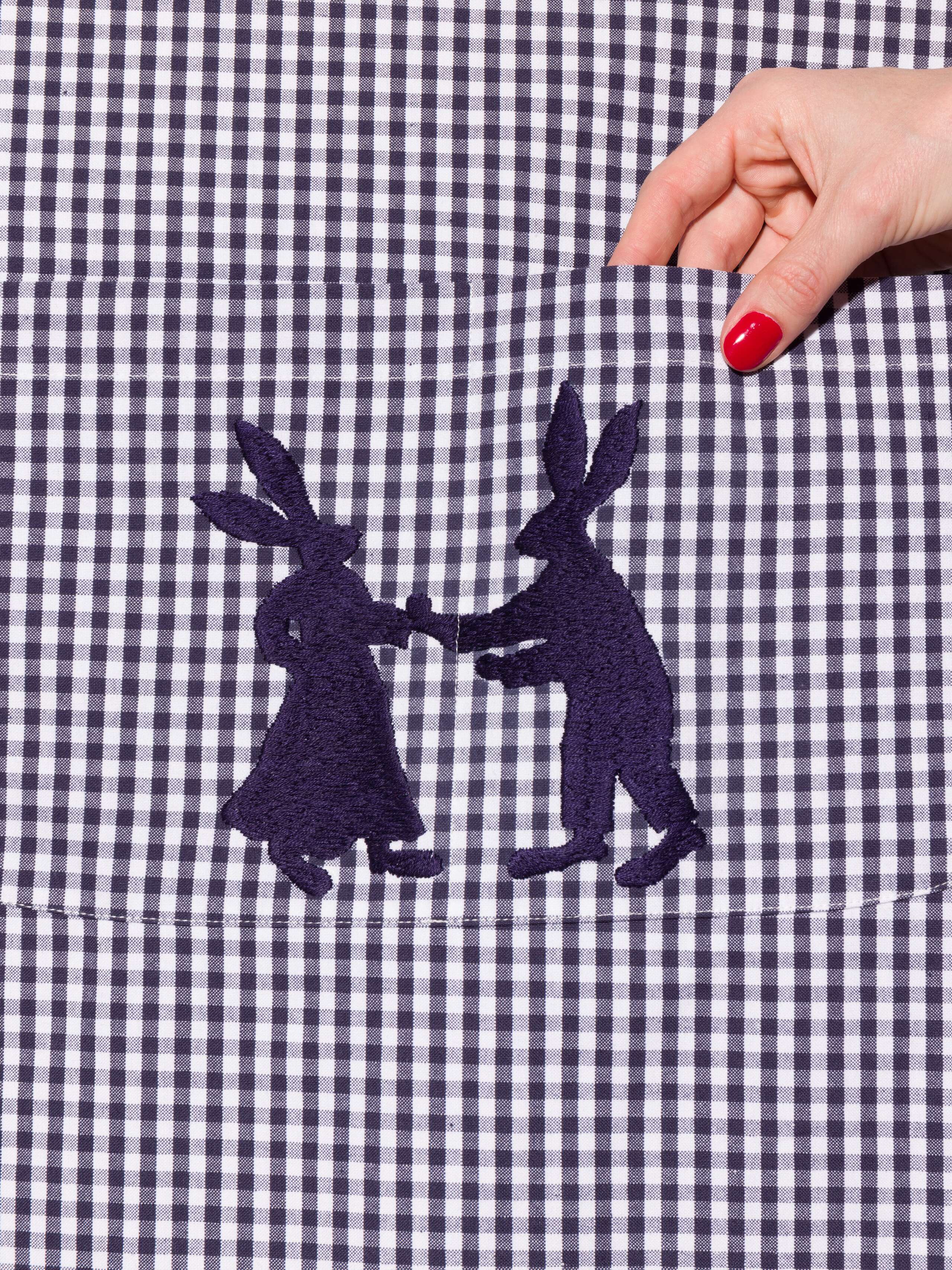 Vichy cotton apron with hand embroidery of dancing rabbits in navy