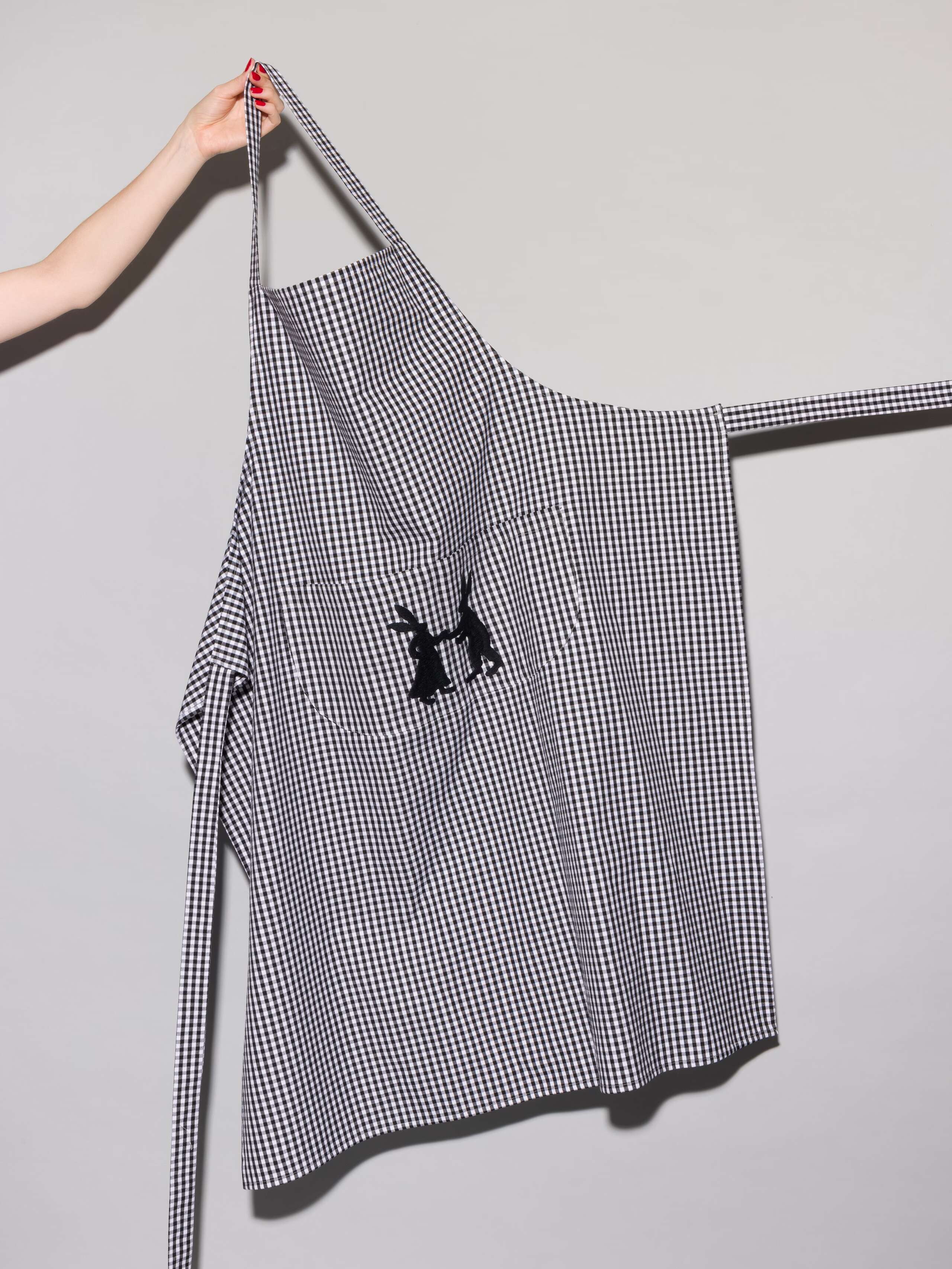 Vichy cotton apron with hand embroidery of dancing rabbits in black
