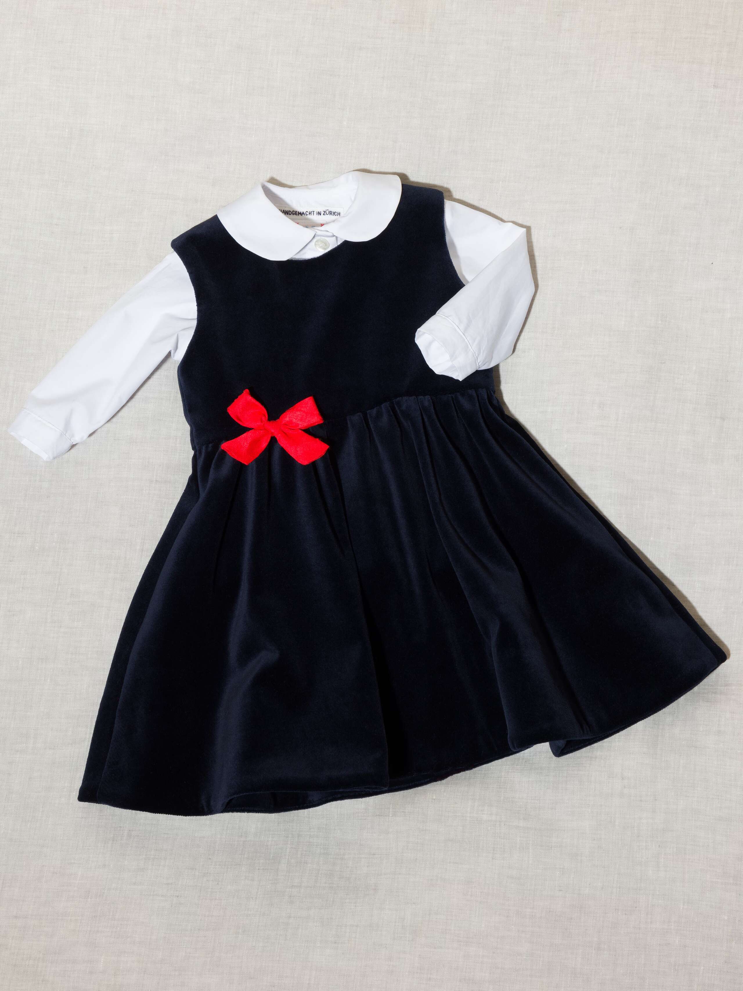 Beautiful cotton velvet baby dress sleeveless with red silk bow handmade in Zurich, navy cotton velvet with poplin bodysuit in white