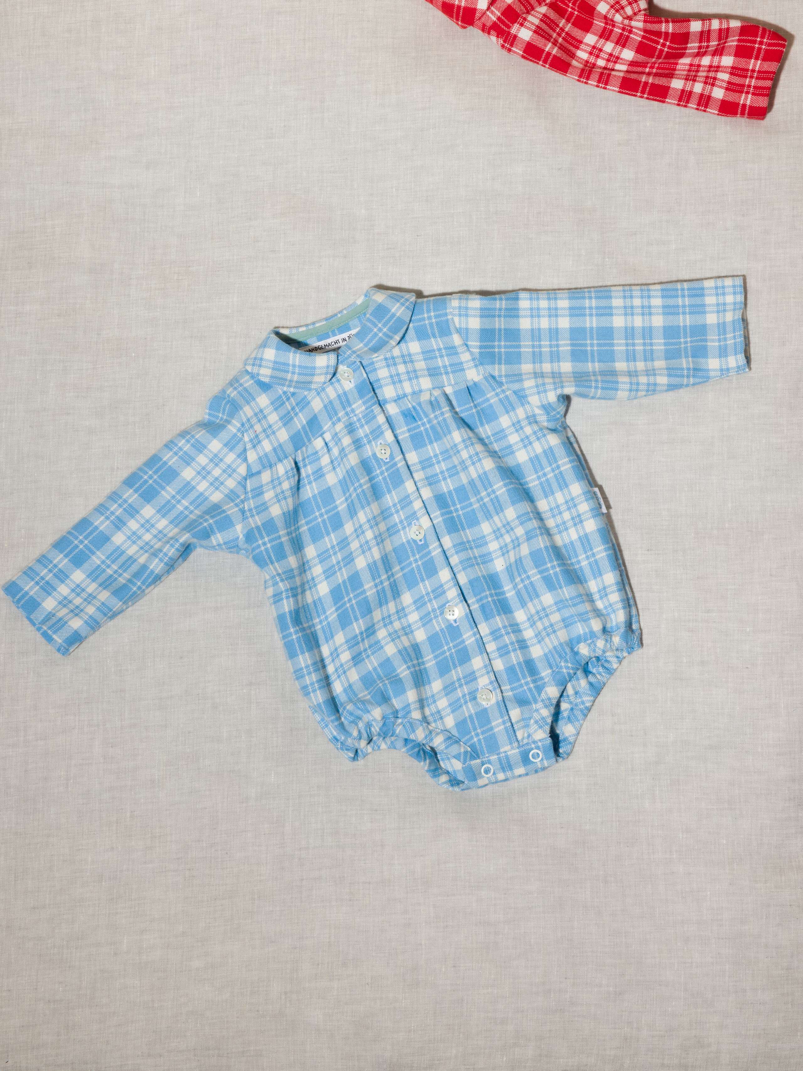 Beautiful handmade cotton flannel baby body in a soft check pattern with long sleeves, light blue