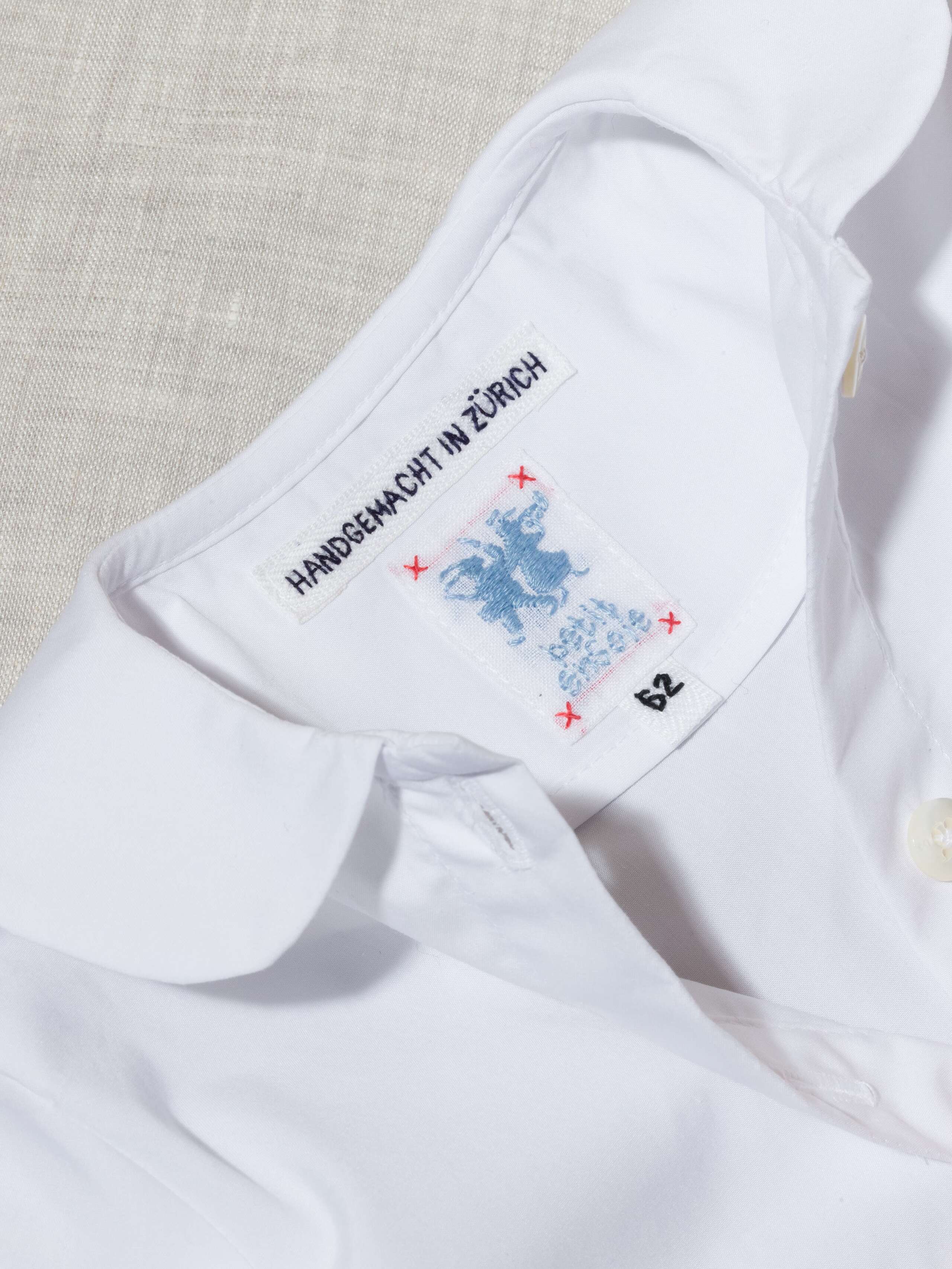 Festive, white poplin cotton baby body with collar handmade in Zurich