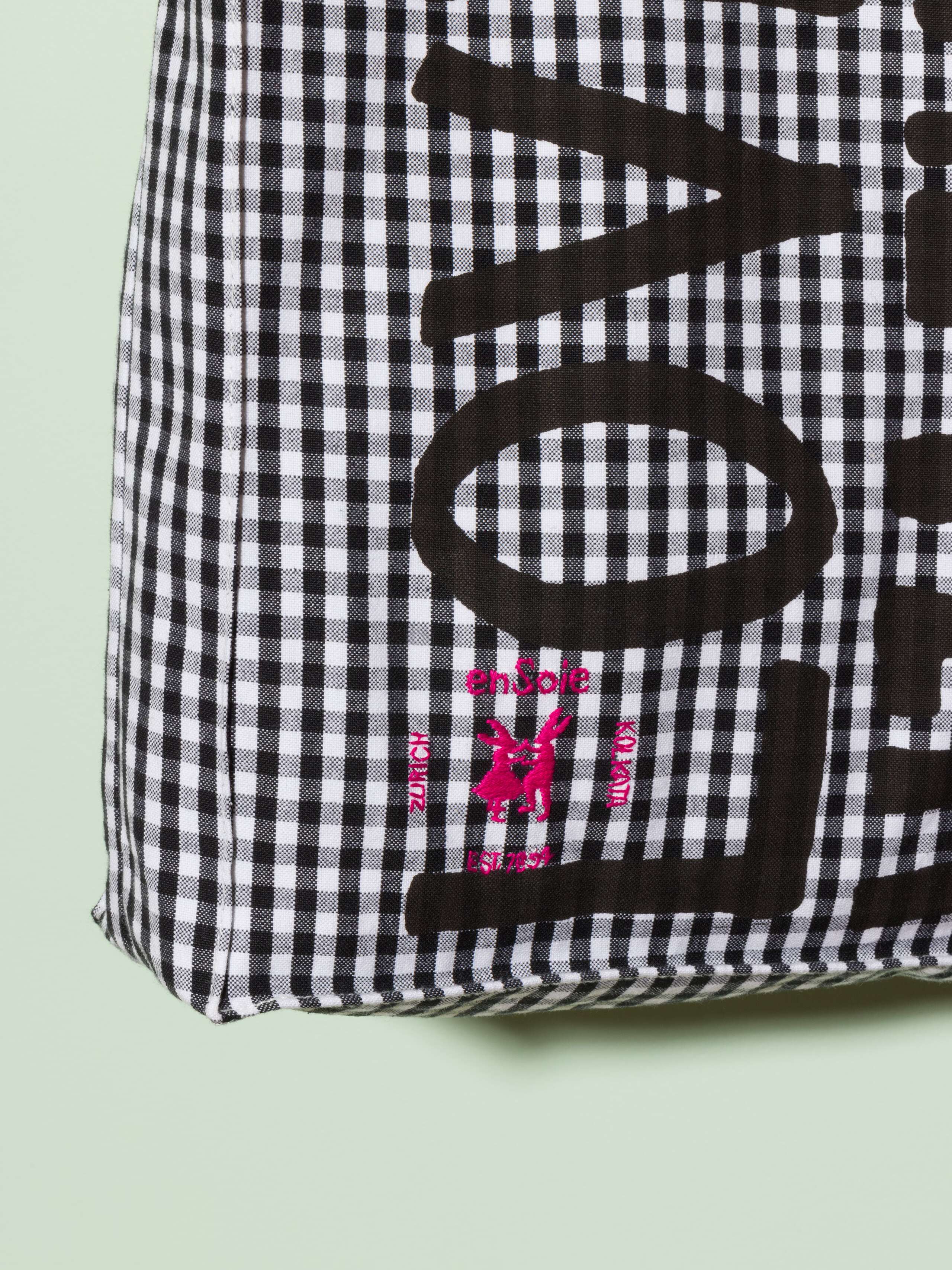  cotton tote bag with a black vichy pattern and a black print that says "Love rules forever" and a rabbit ebroidery