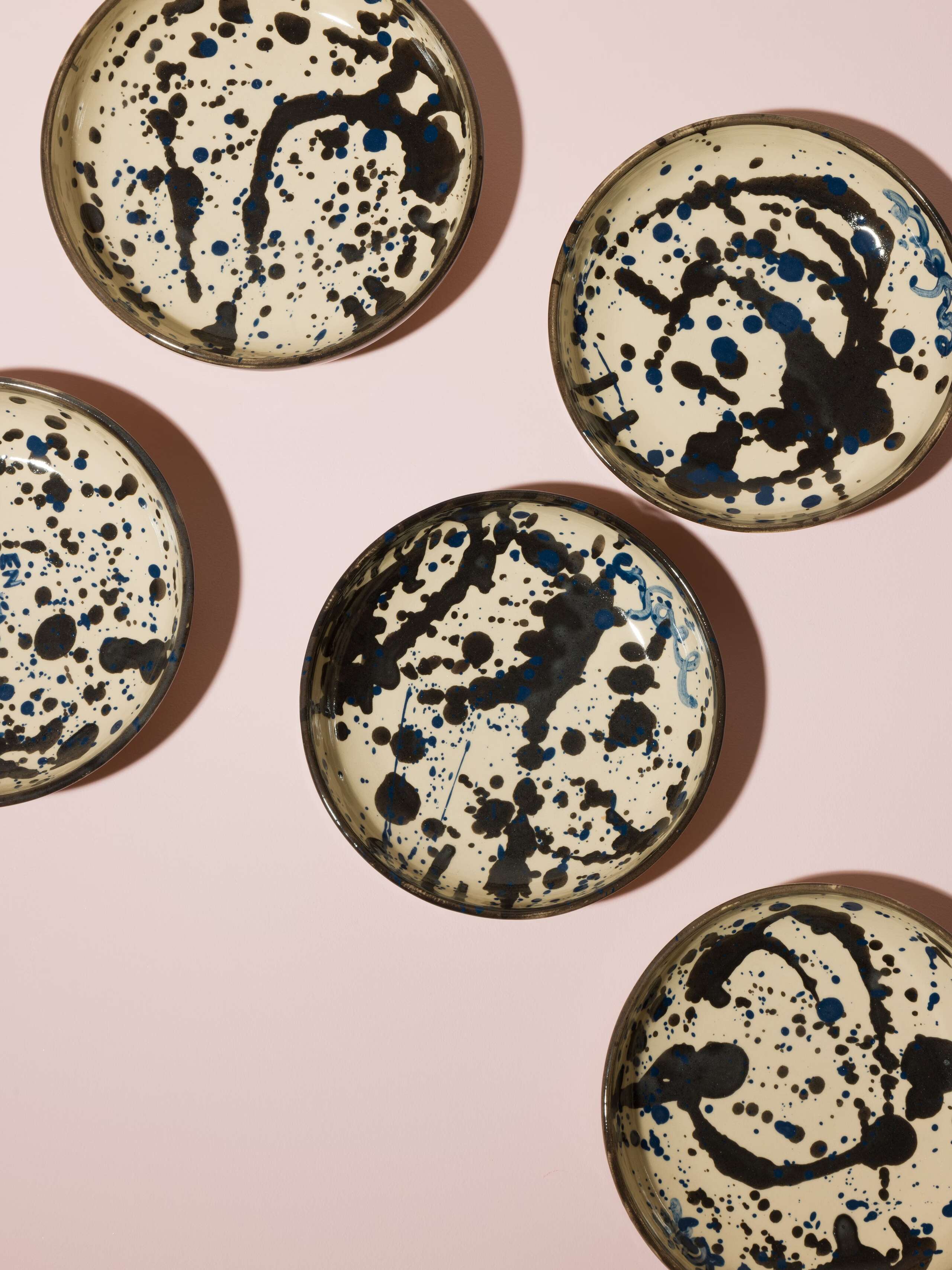 Hand painted plates with blue an black sprinkles 