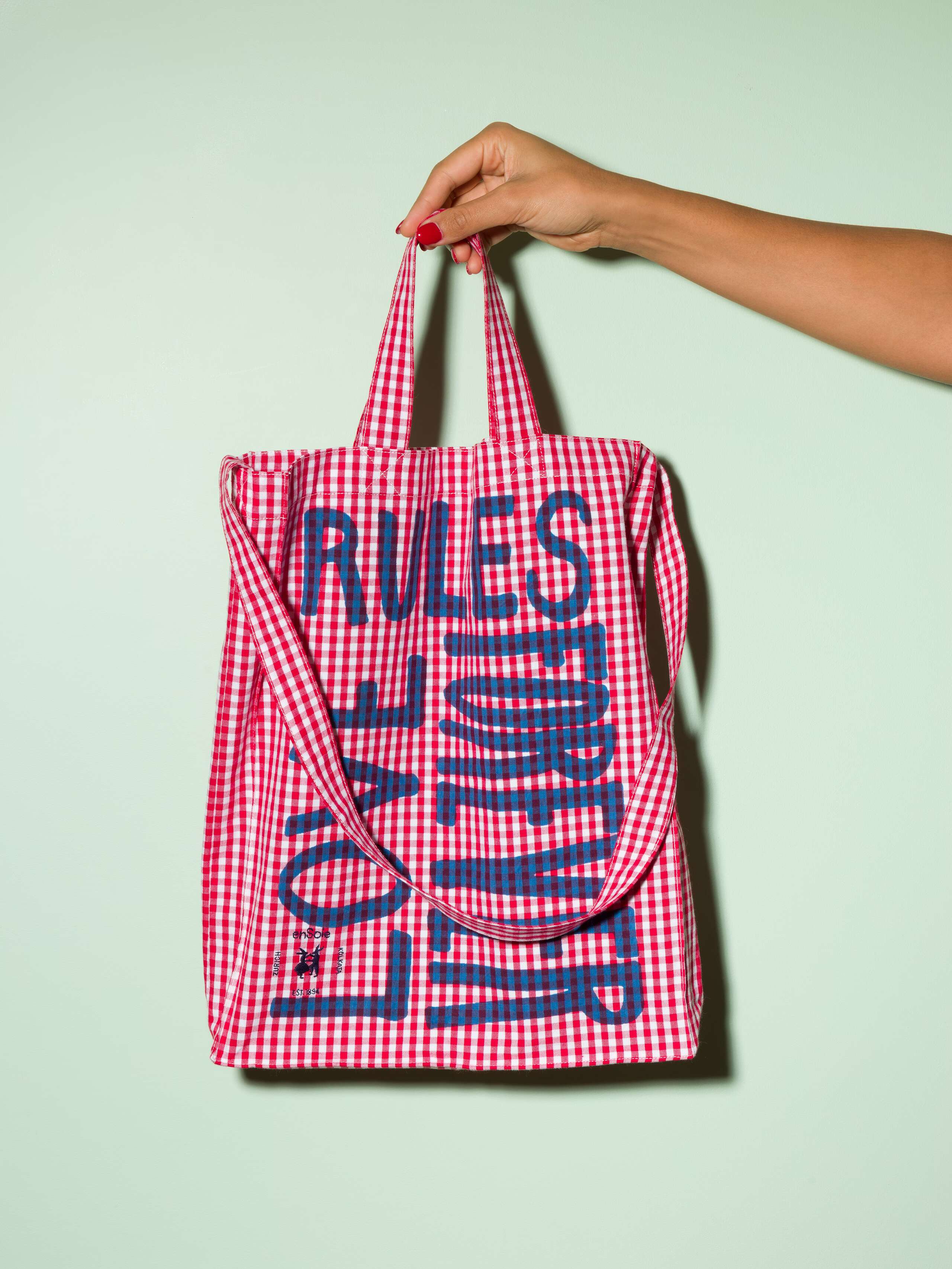  cotton tote bag with a red vichy pattern and a navy print that says "Love rules forever" and a rabbit ebroidery