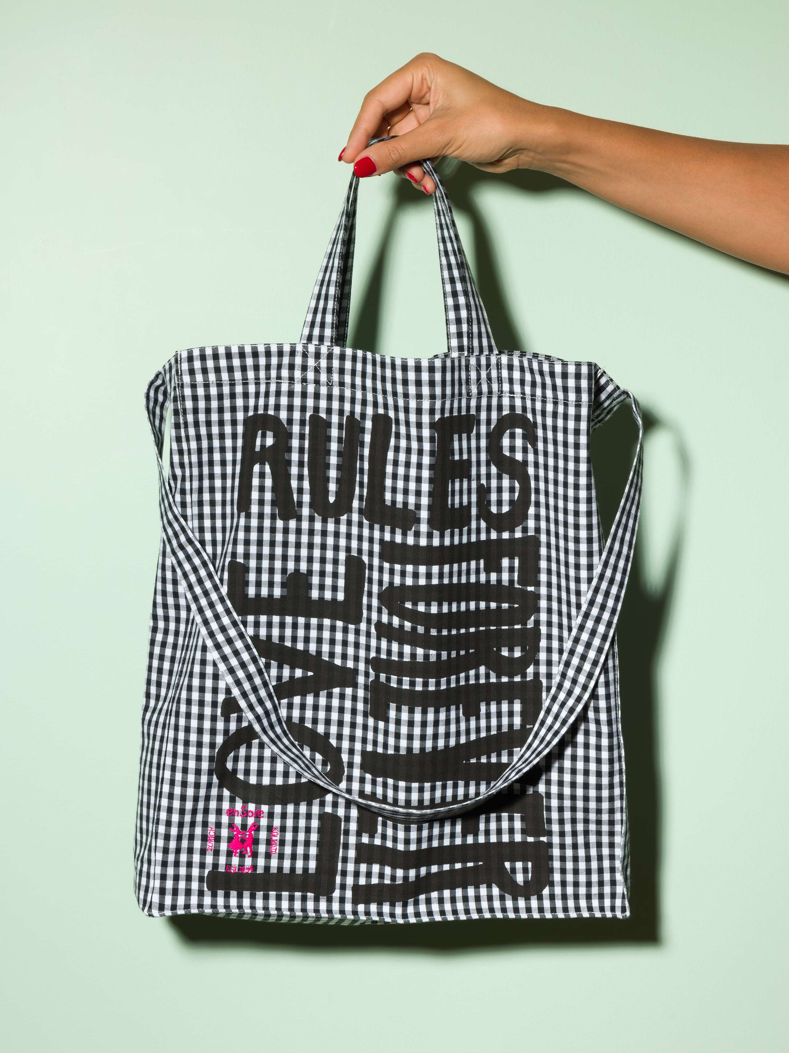  cotton tote bag with a black vichy pattern and a black print that says "Love rules forever" and a rabbit ebroidery