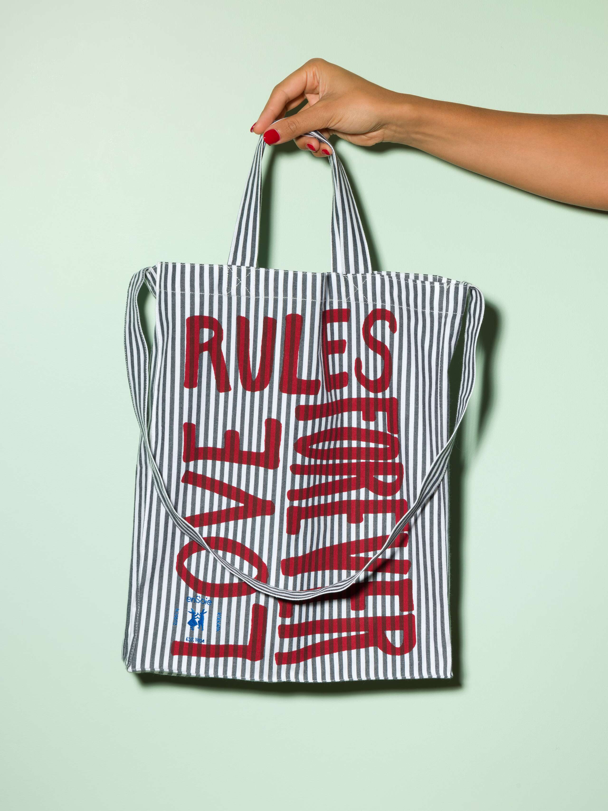  cotton tote bag with a navy stripe pattern and a red print that says "Love rules forever" and a rabbit ebroidery
