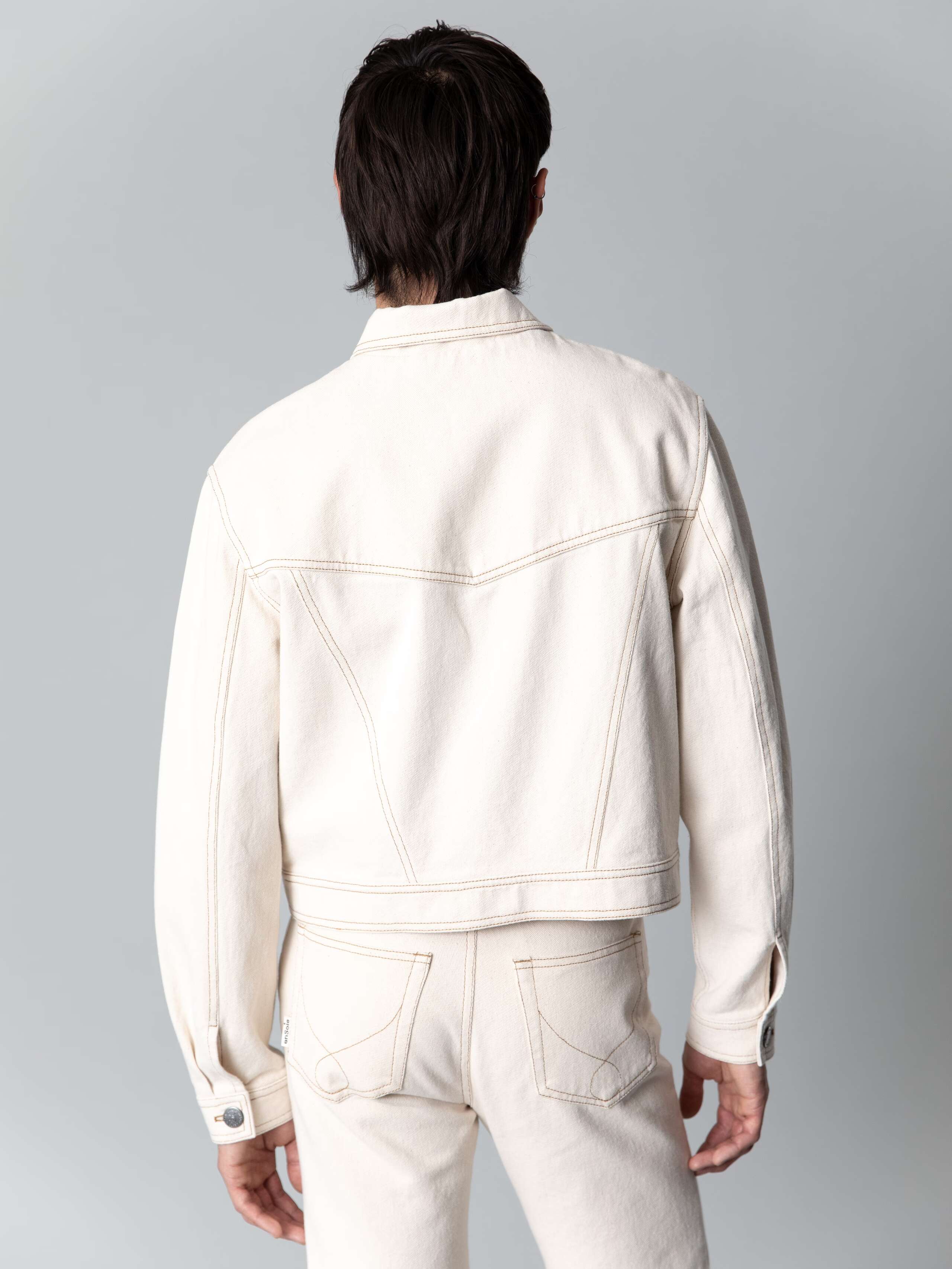 Male model is wearing a cool boxy denim jacket in a nice ecru colour shade