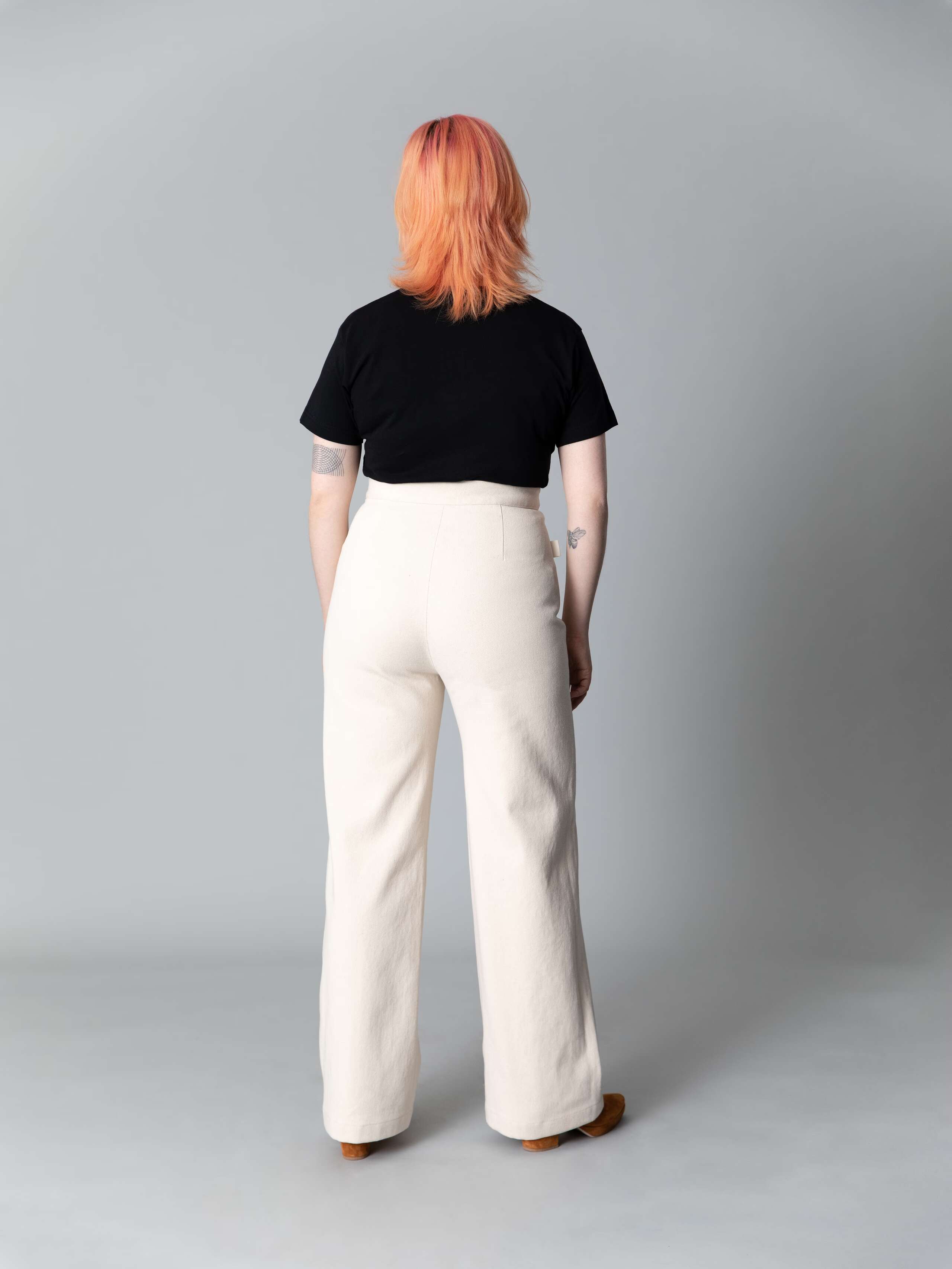 Model is weraing a beautiful wide leg and high waist jeans in ecru with 