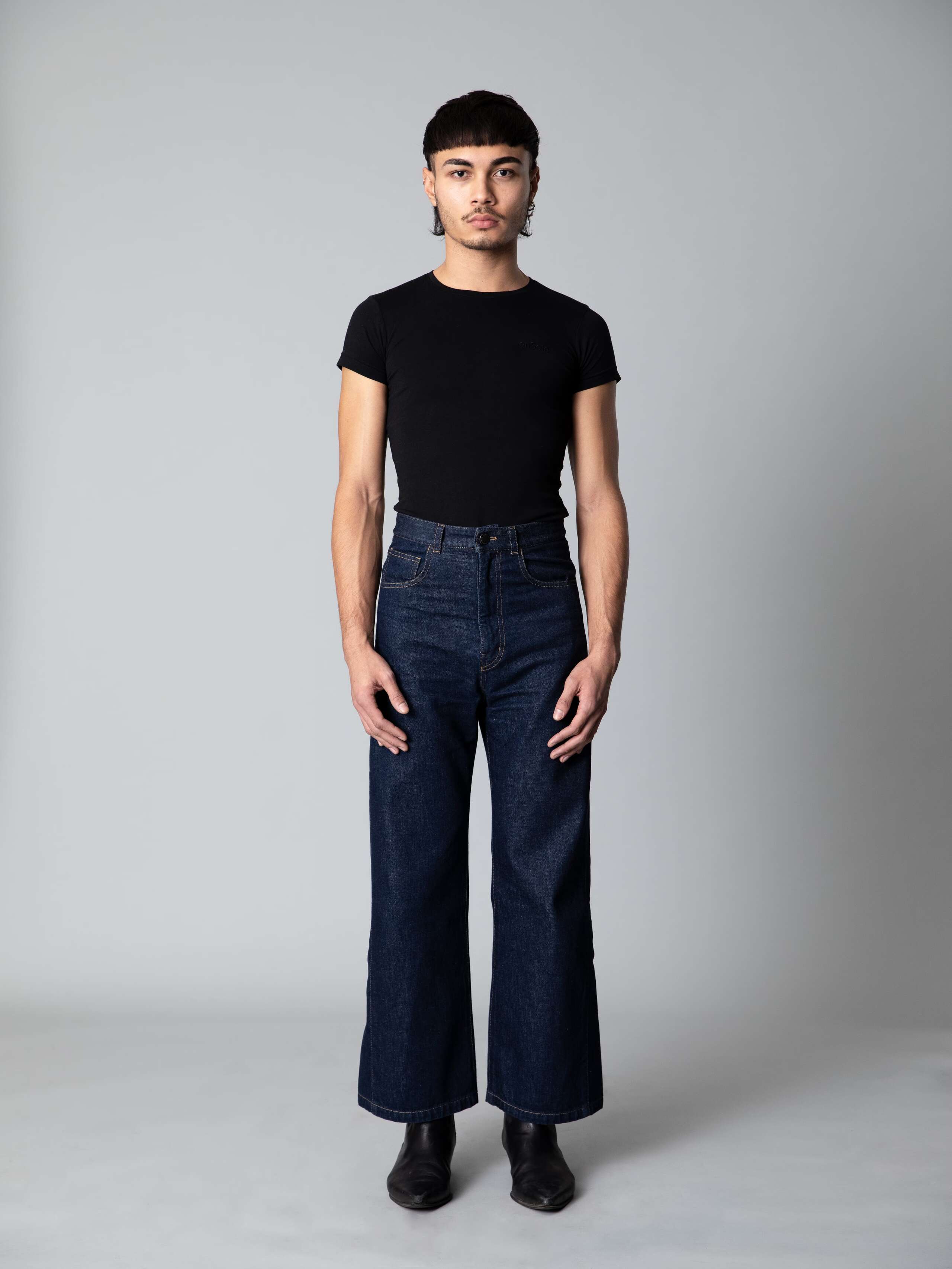 Male model wears a beautiful wide leg jeans