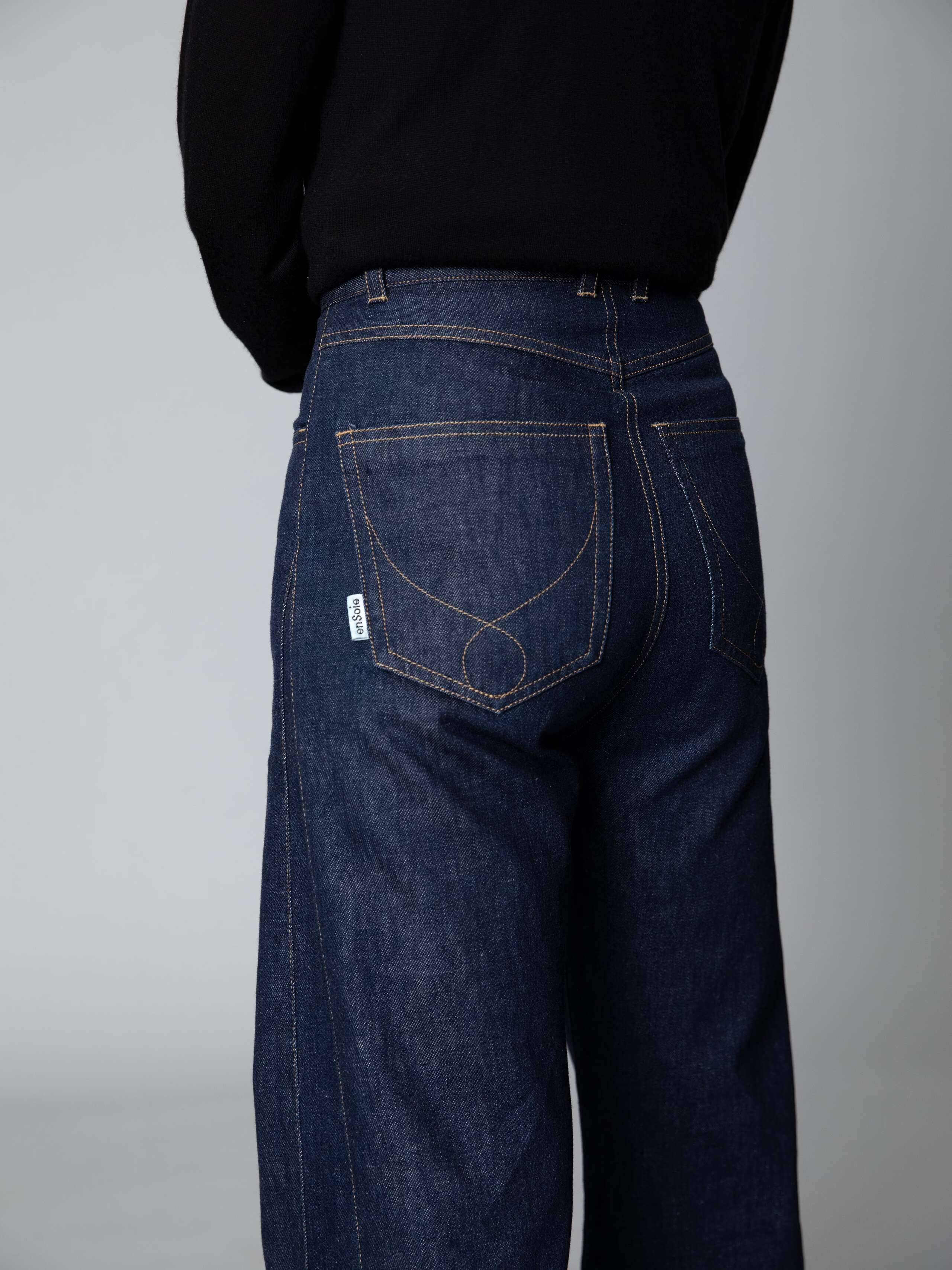 Detail of a beautiful wide leg jeans in dark pure indigo 
