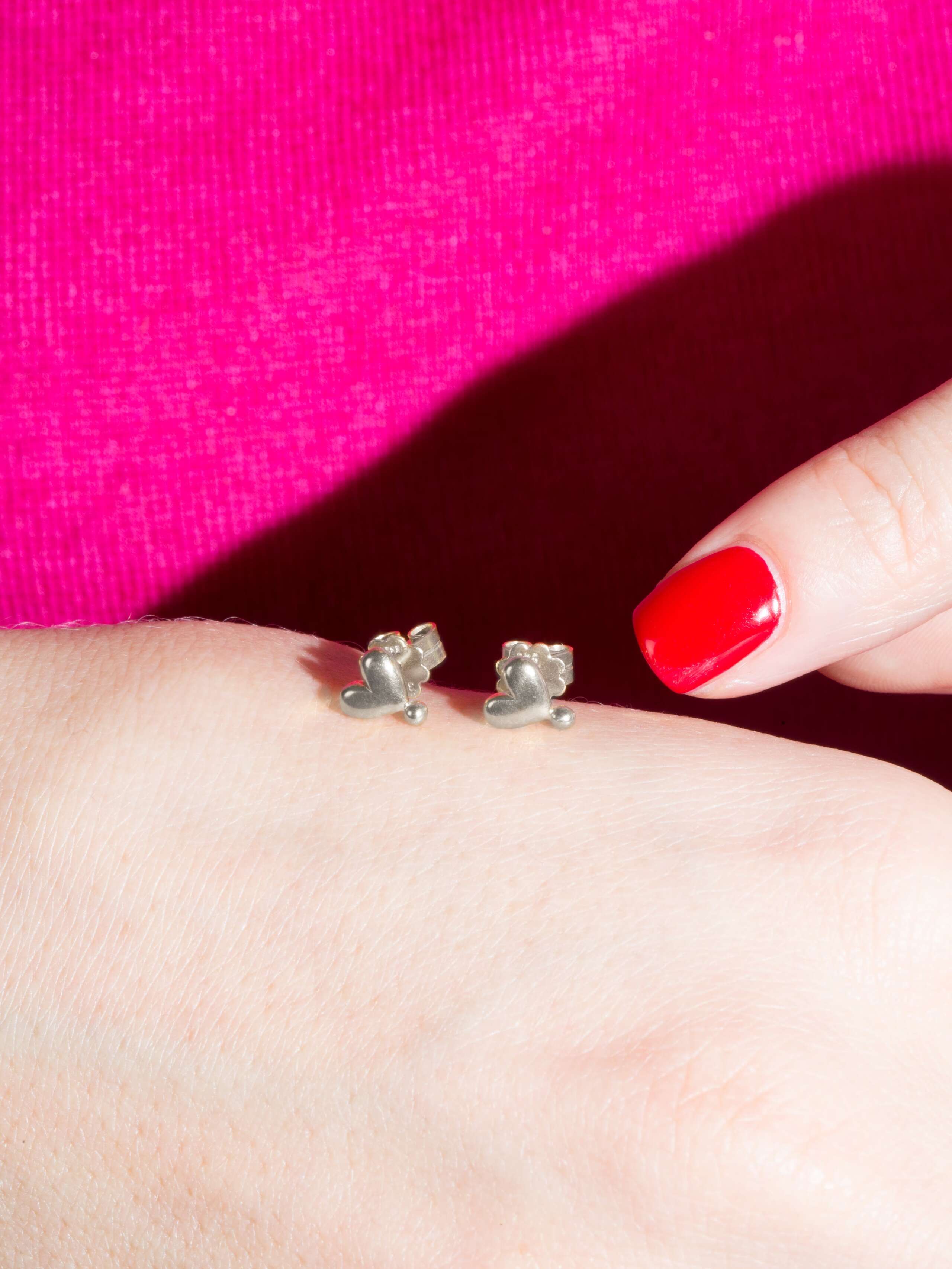 Picture of a silver ear stud in a beautiful heart shape
