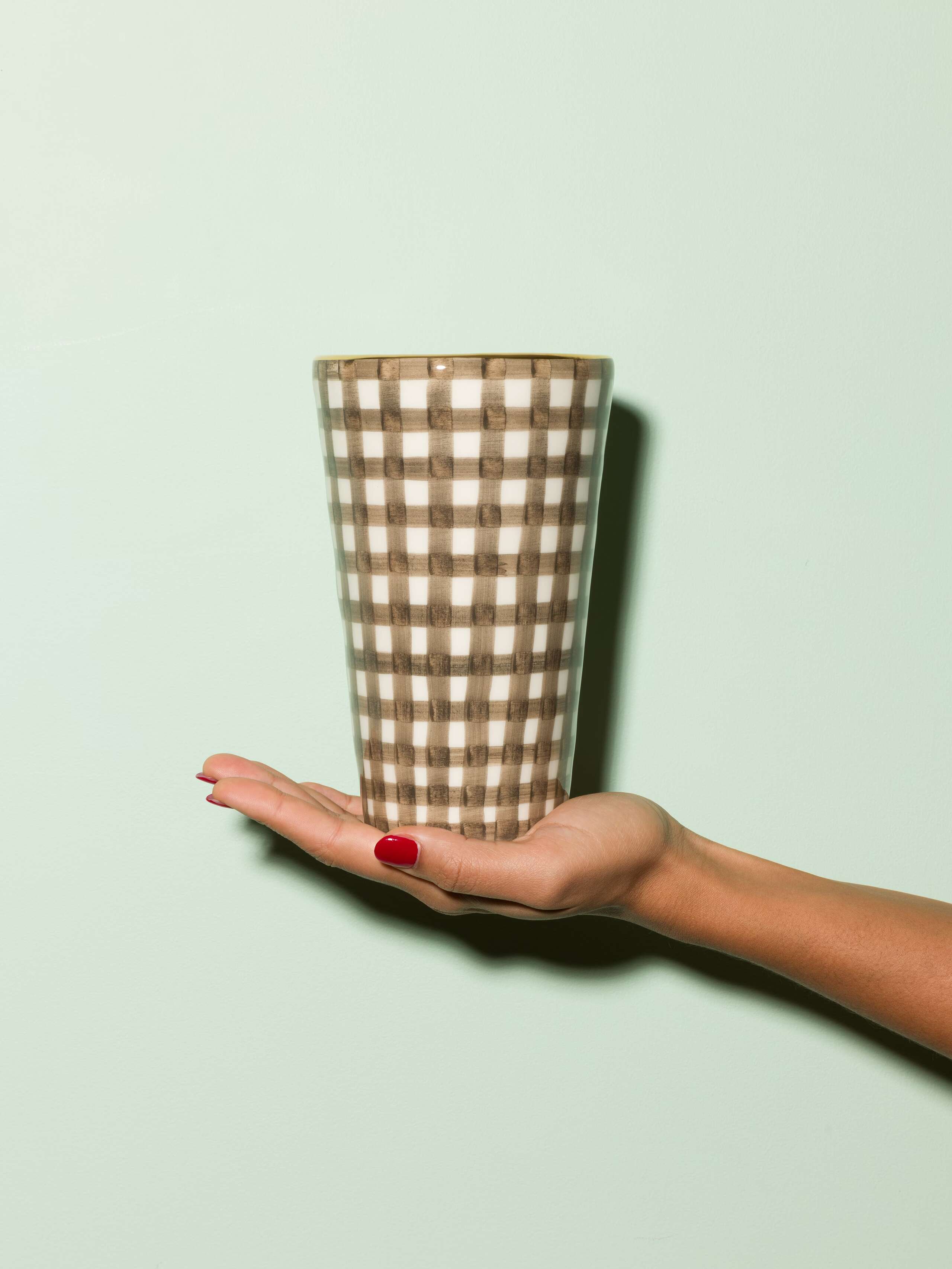 Picture of a small vase featuring a beautiful vichy check pattern in warm brown