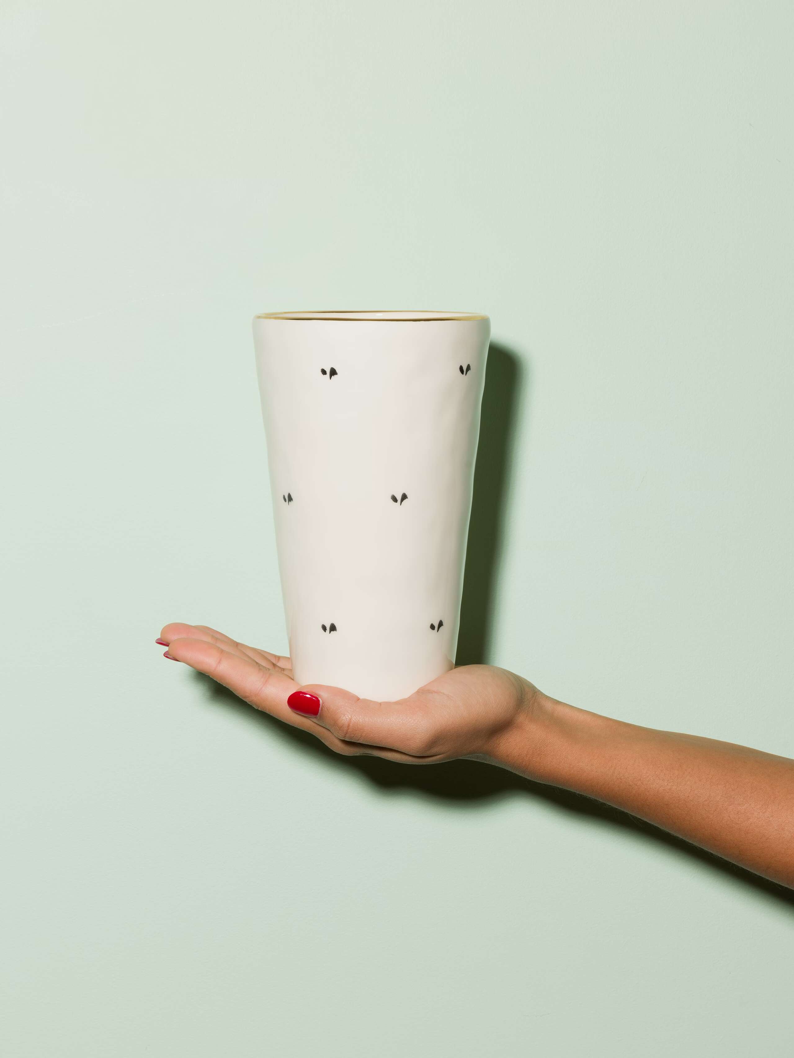 Picture of a small vase featuring a beautiful black ermine pattern 