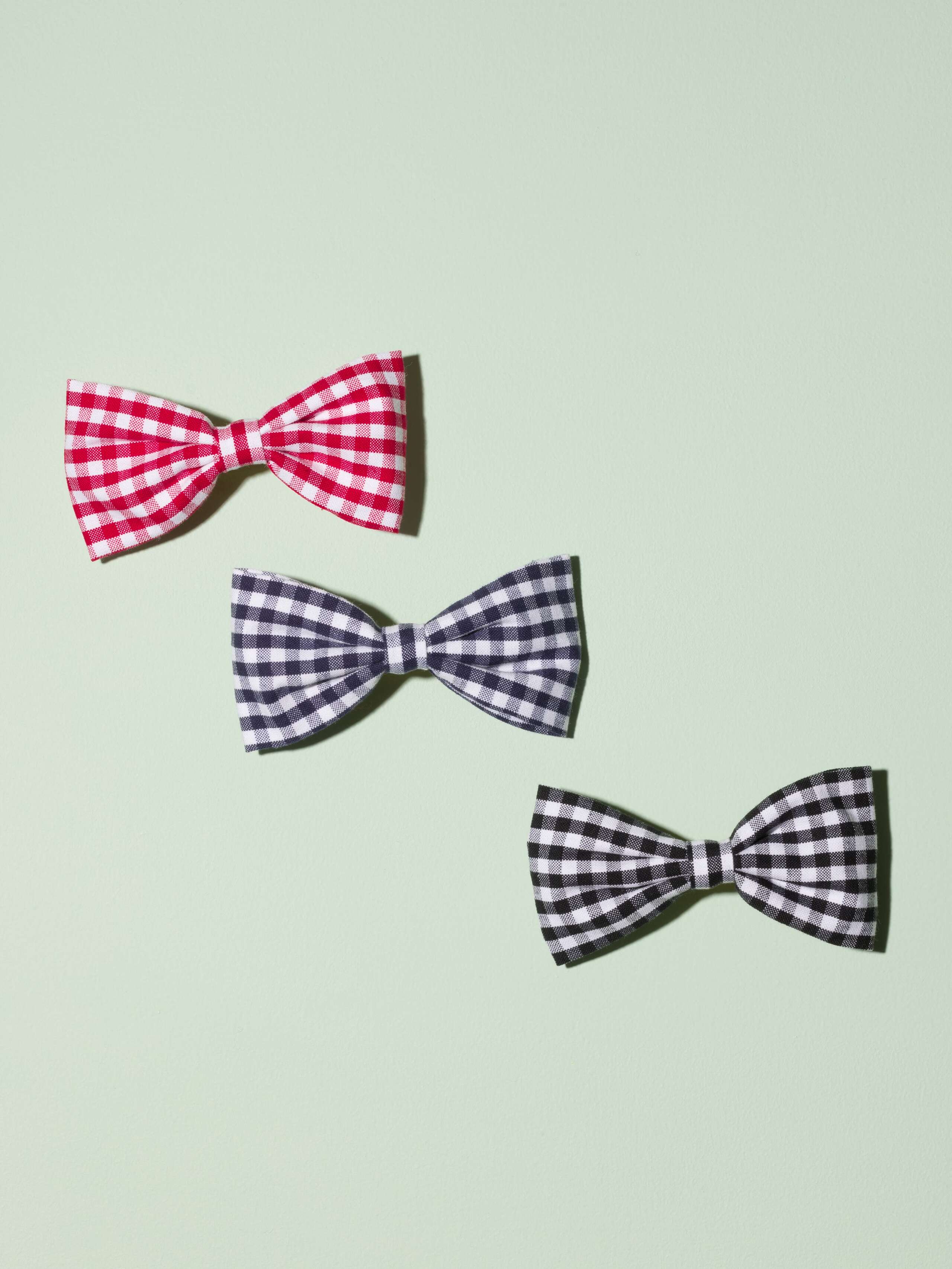 Three cute bow hair clips made of cotton featuring a cute vichy check pattern