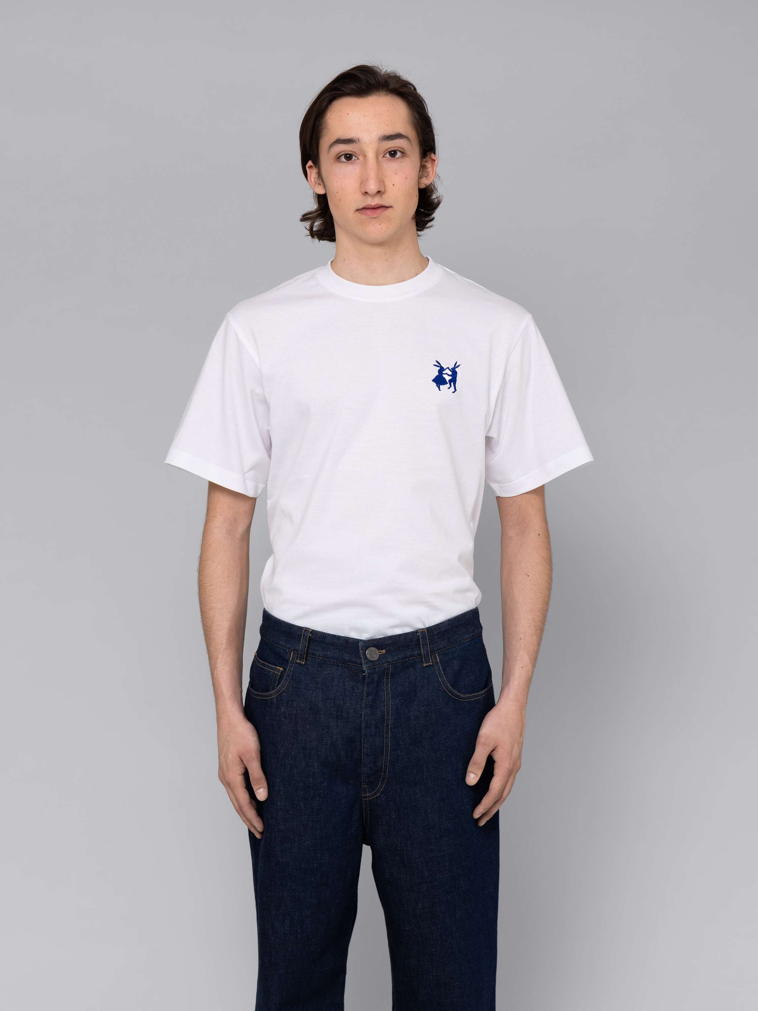Male model is wearing a combination of a classic jeans and a white t-shirt