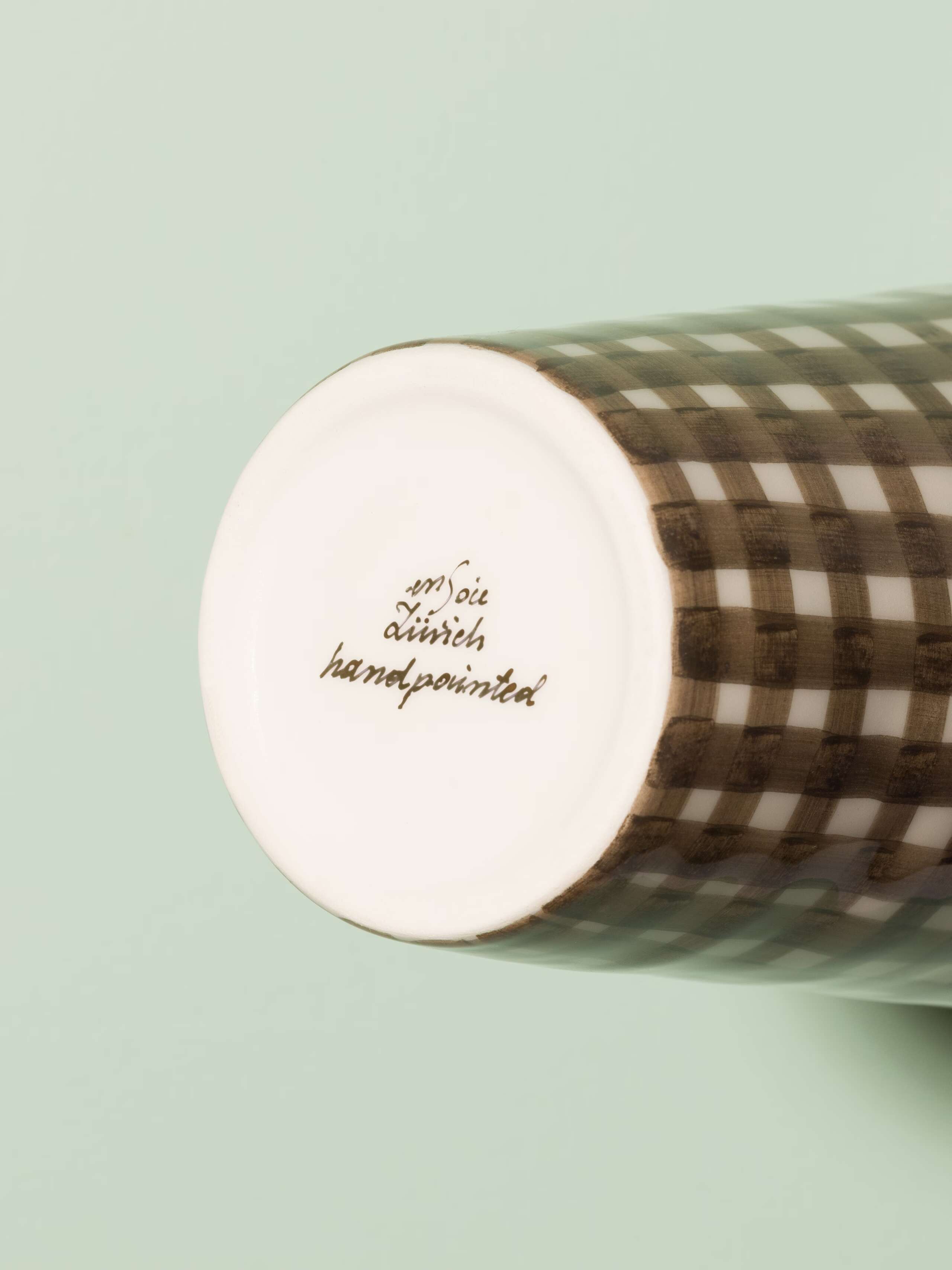 Picture of a small vase featuring a beautiful vichy check pattern in warm brown