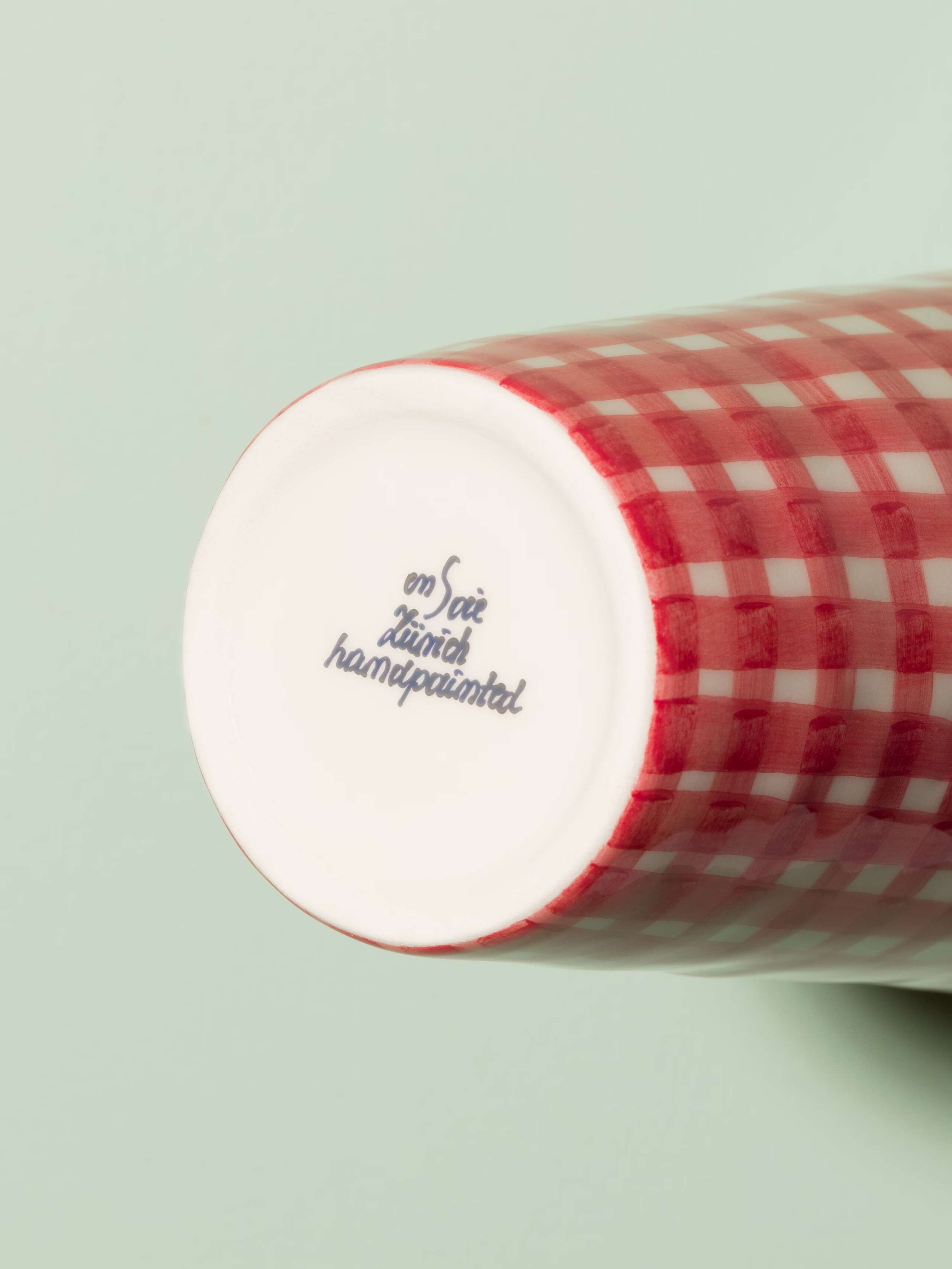 Picture of a small vase featuring a beautiful vichy check pattern in red