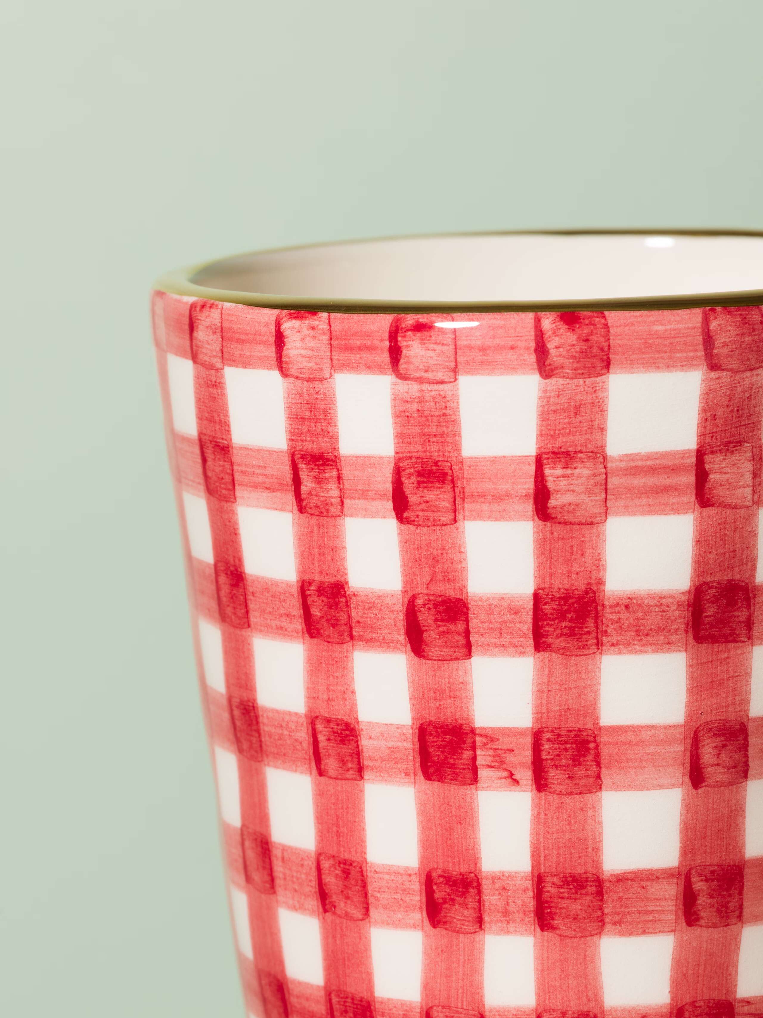 Picture of a small vase featuring a beautiful vichy check pattern in red