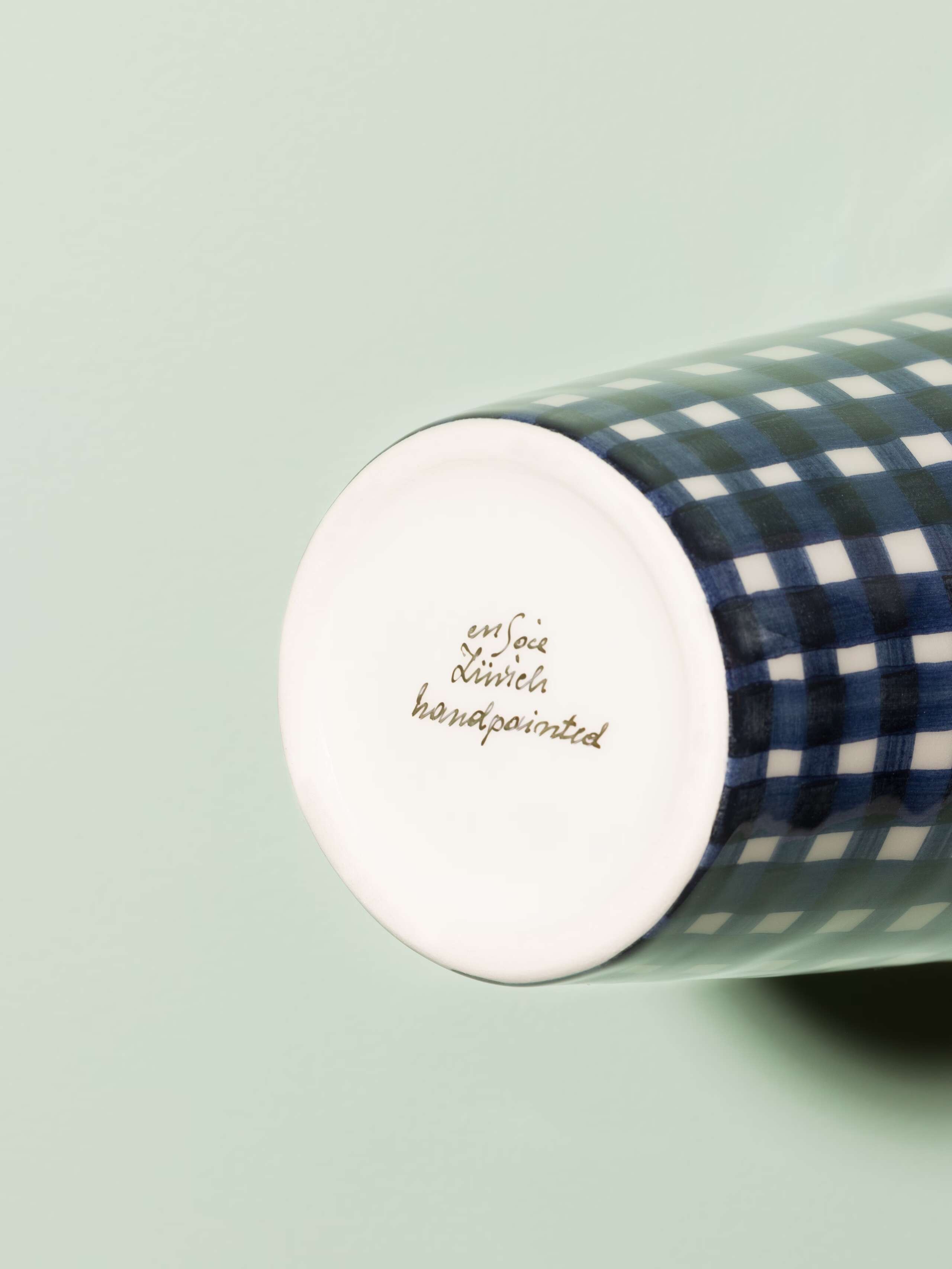 Picture of a small vase featuring a beautiful vichy check pattern in navy blue
