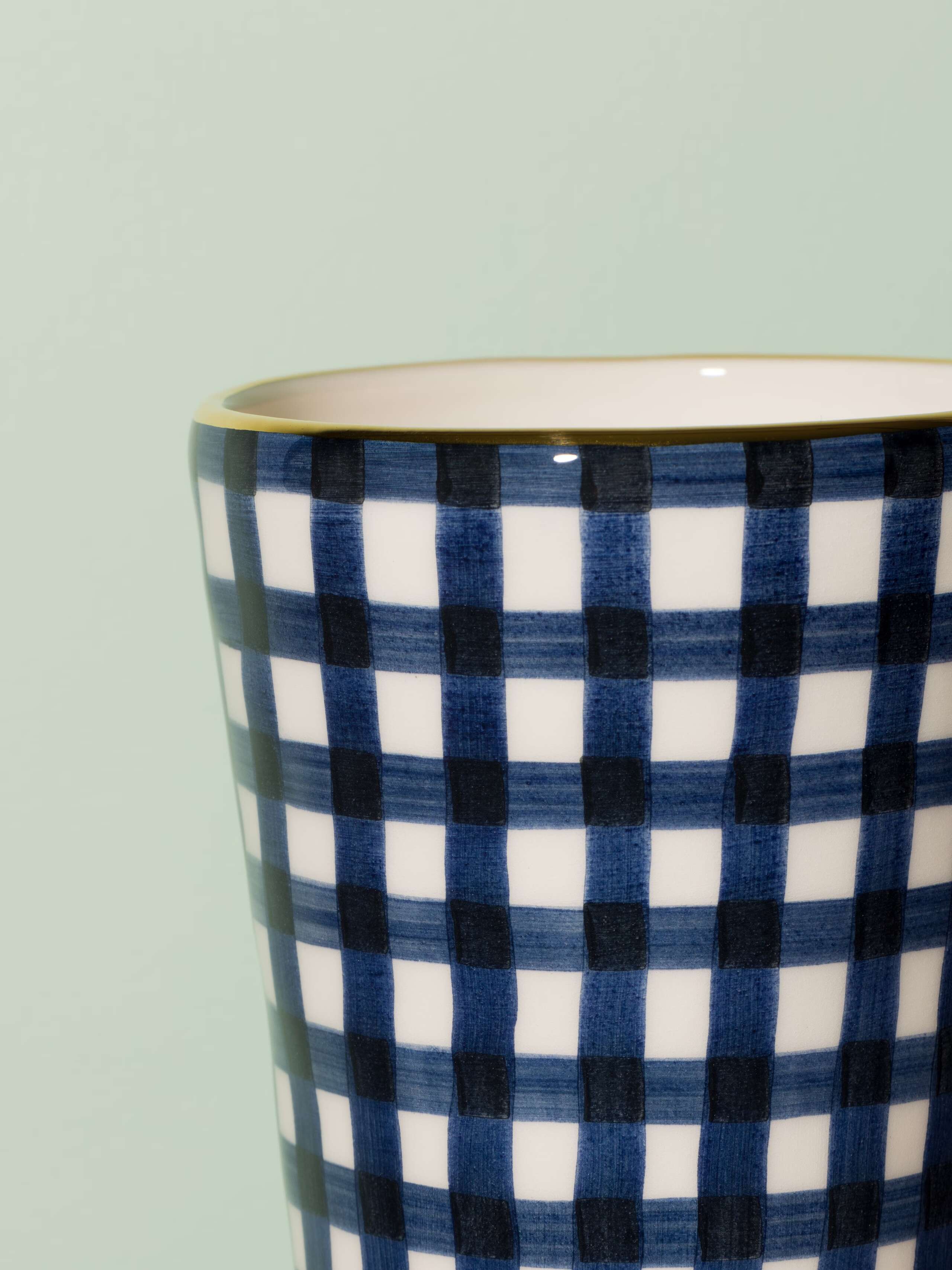 Picture of a small vase featuring a beautiful vichy check pattern in navy blue
