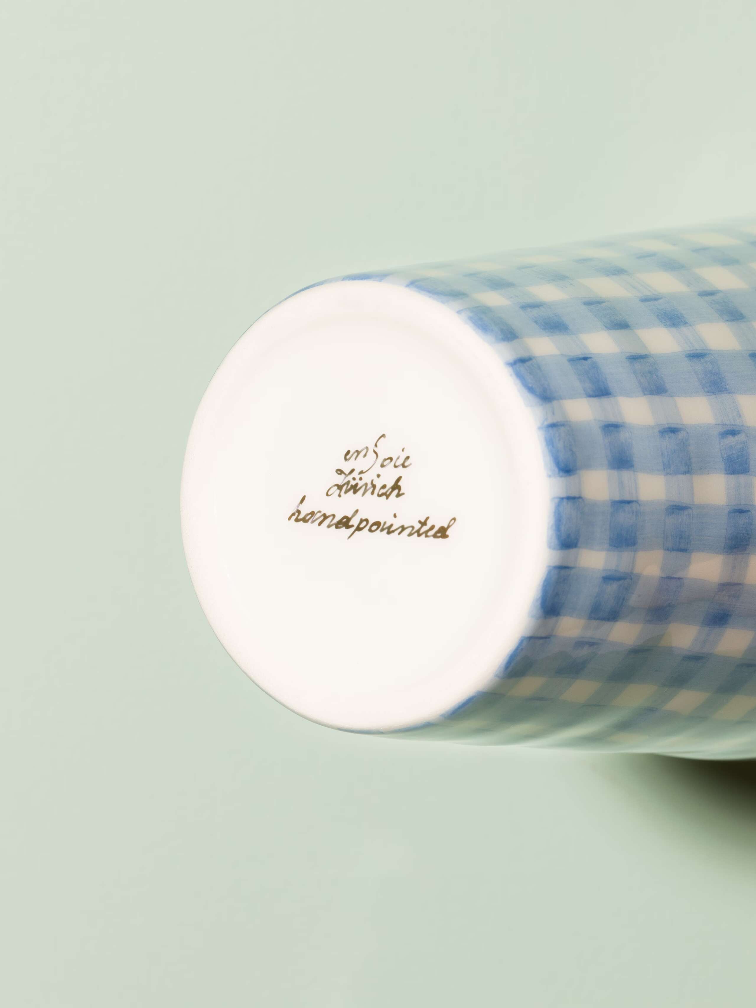 Picture of a small vase featuring a beautiful vichy check pattern in light blue