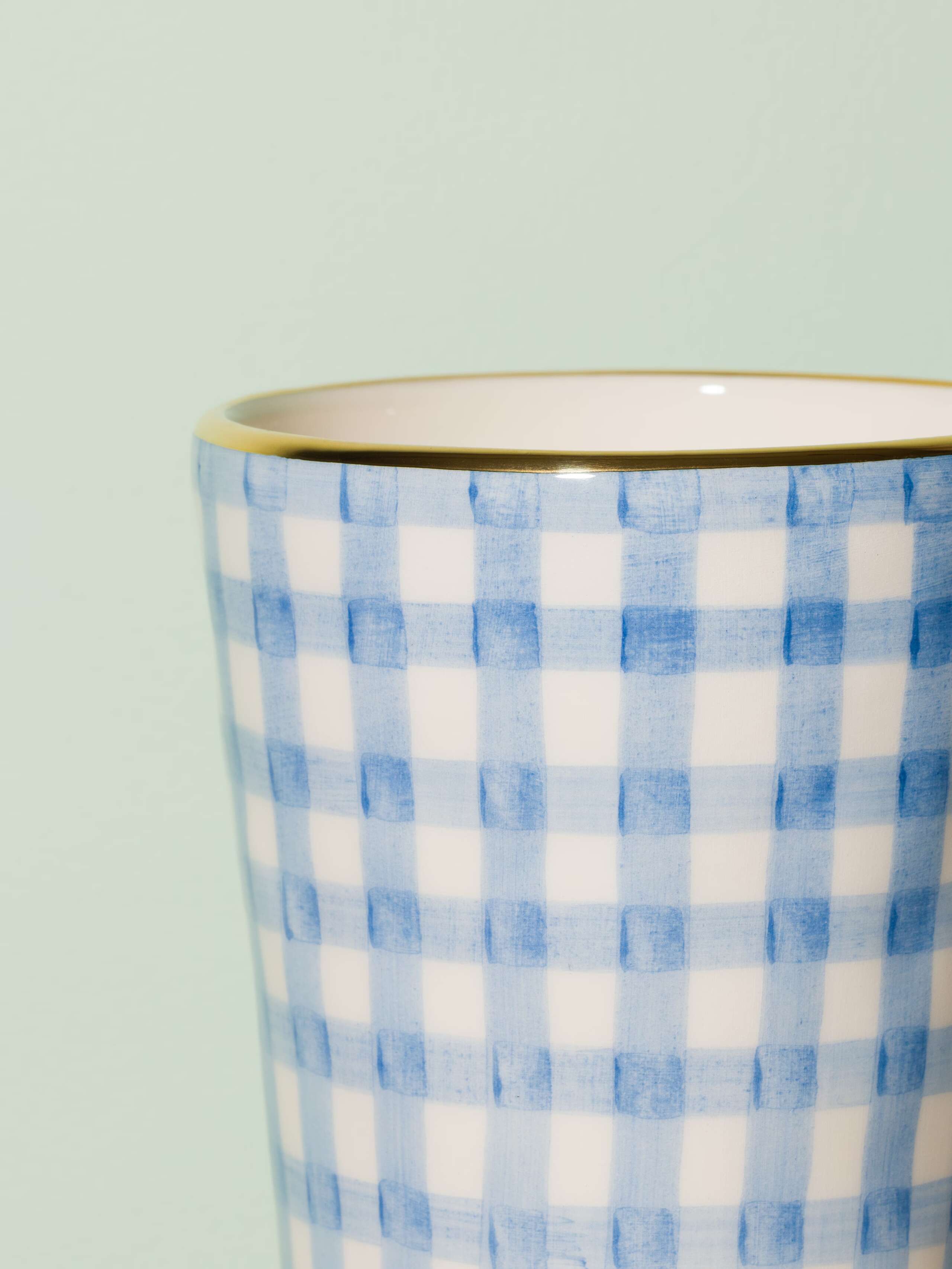 Picture of a small vase featuring a beautiful vichy check pattern in light blue