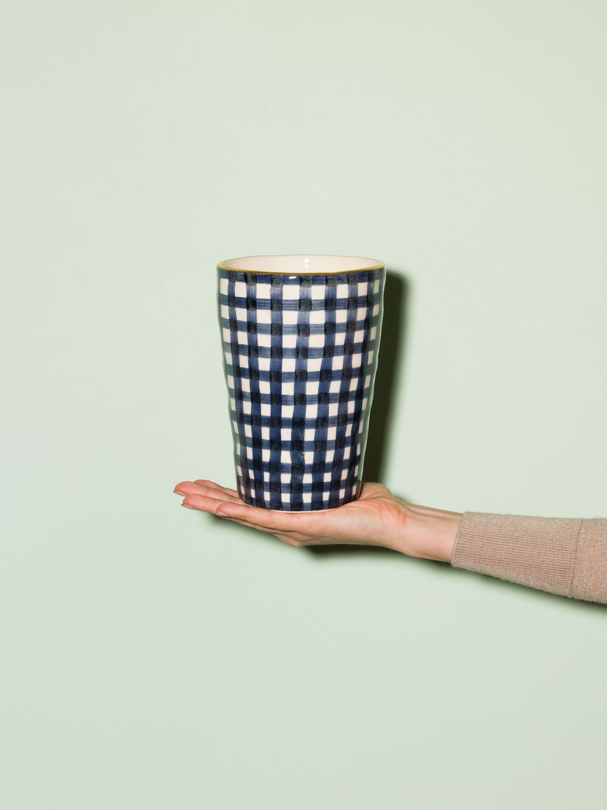 Picture of a handmade and handprinted vase made of ceramic featuring a navy blue vichy check pattern