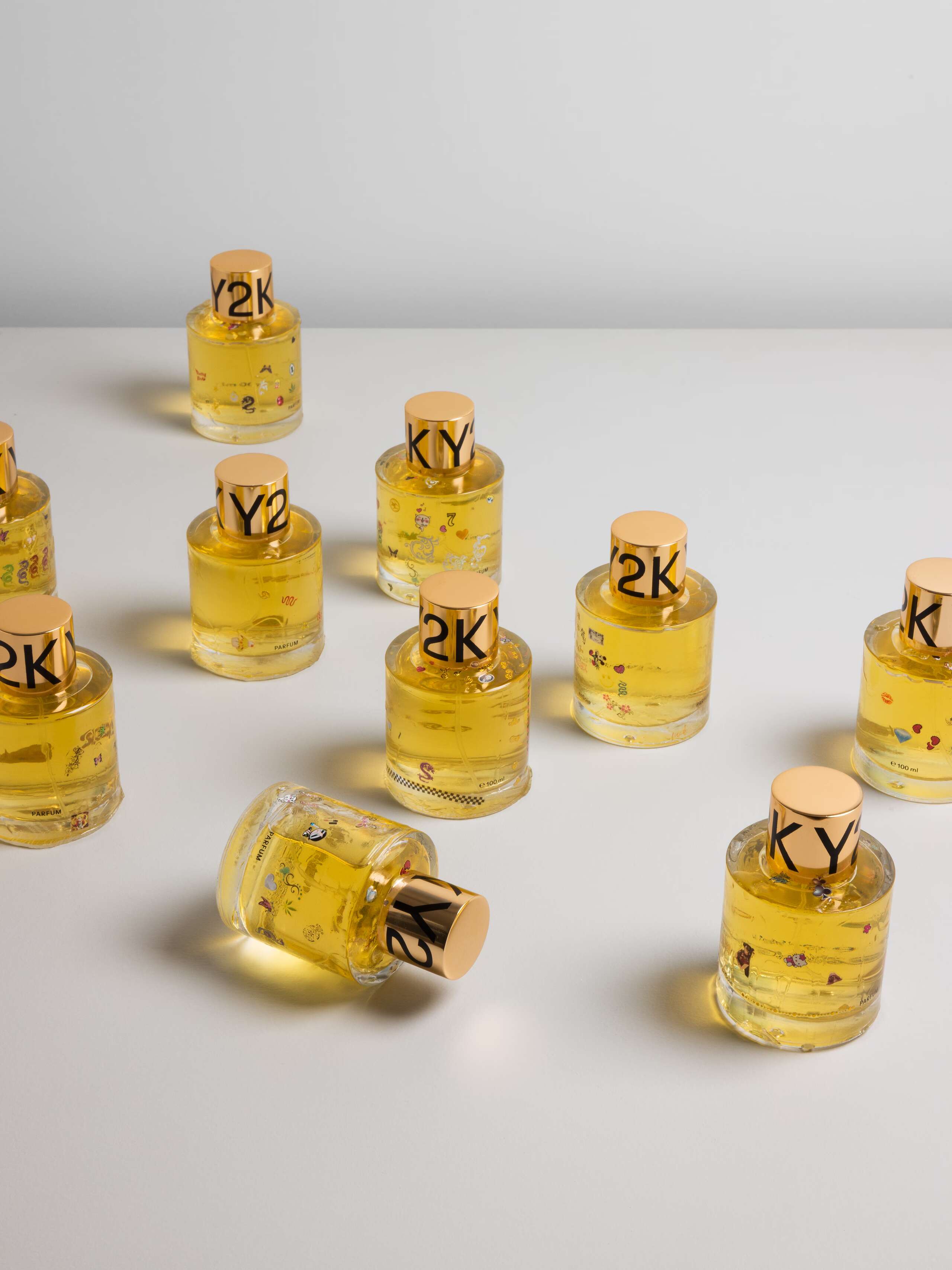 Picture of ten artfully designed perfume flacons with the name Y2K. The design is made by French artist Caroline Ventura.