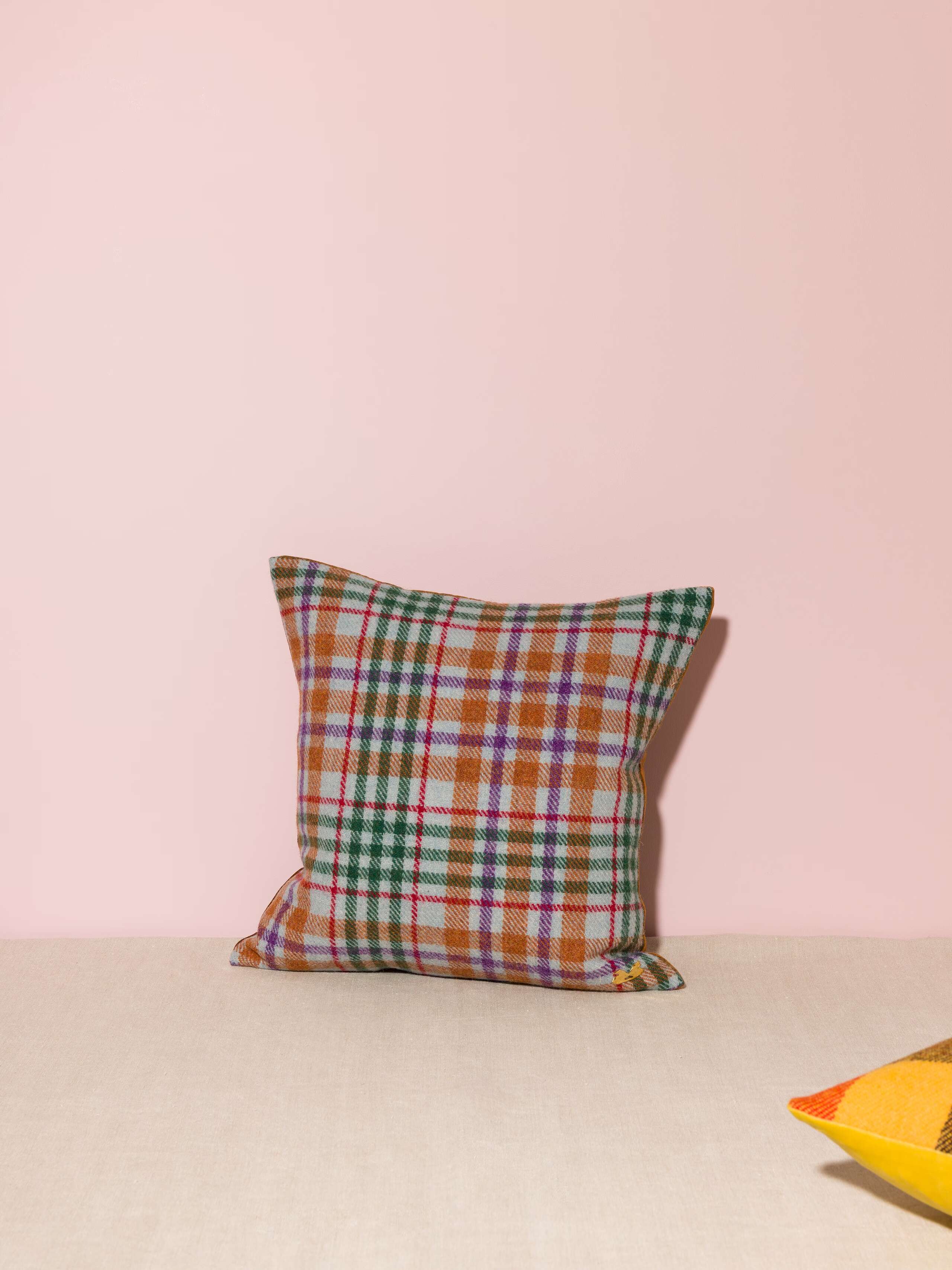 Picture of a beautiful pillow cover made of colourful Harris Tweed and brown cotton velvet