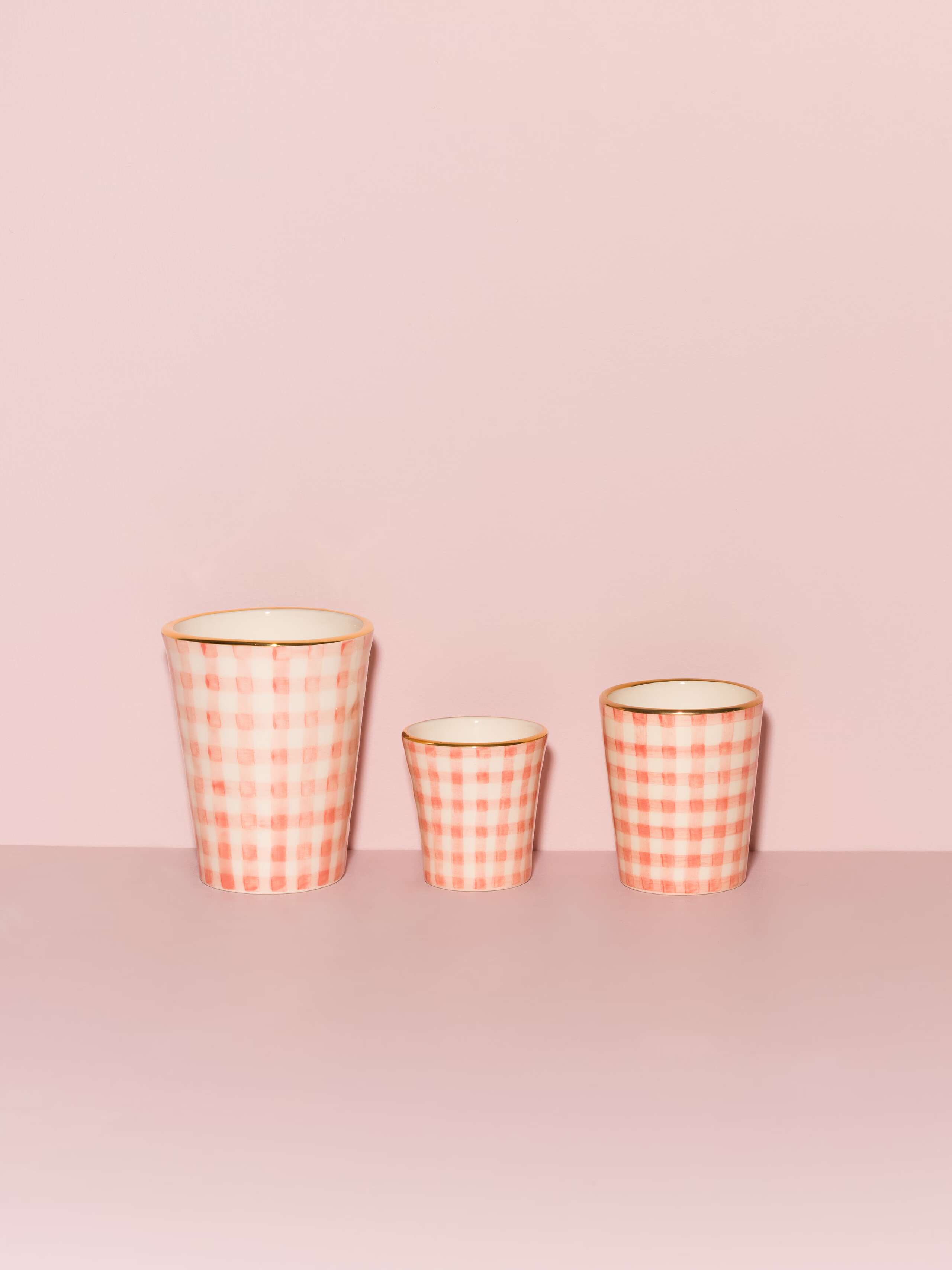 Picture of three beautiful handmade cups in three different sizes featuring a pink vichy check pattern
