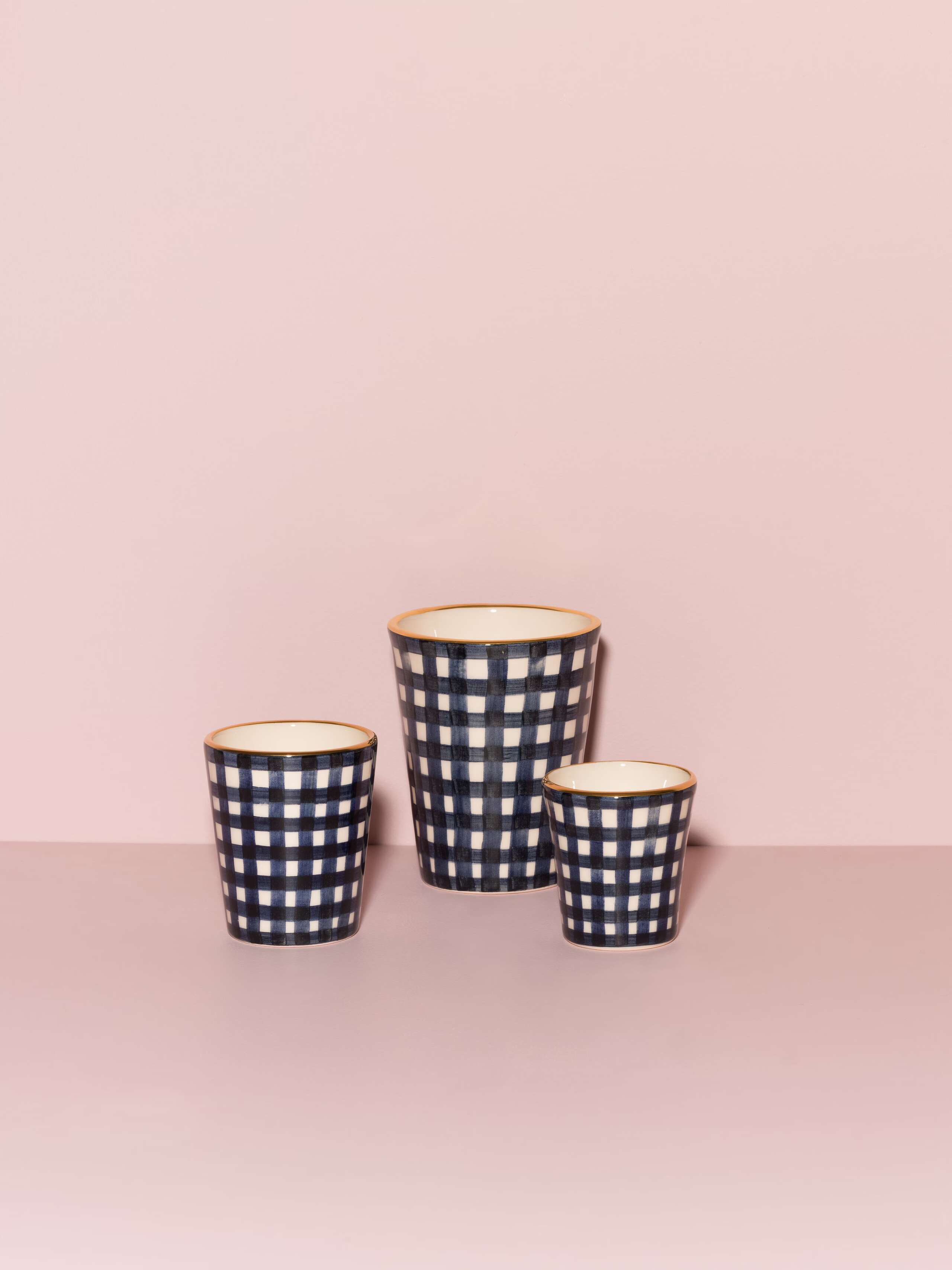 Picture of three beautiful handmade cups in three different sizes featuring a navy blue vichy check pattern