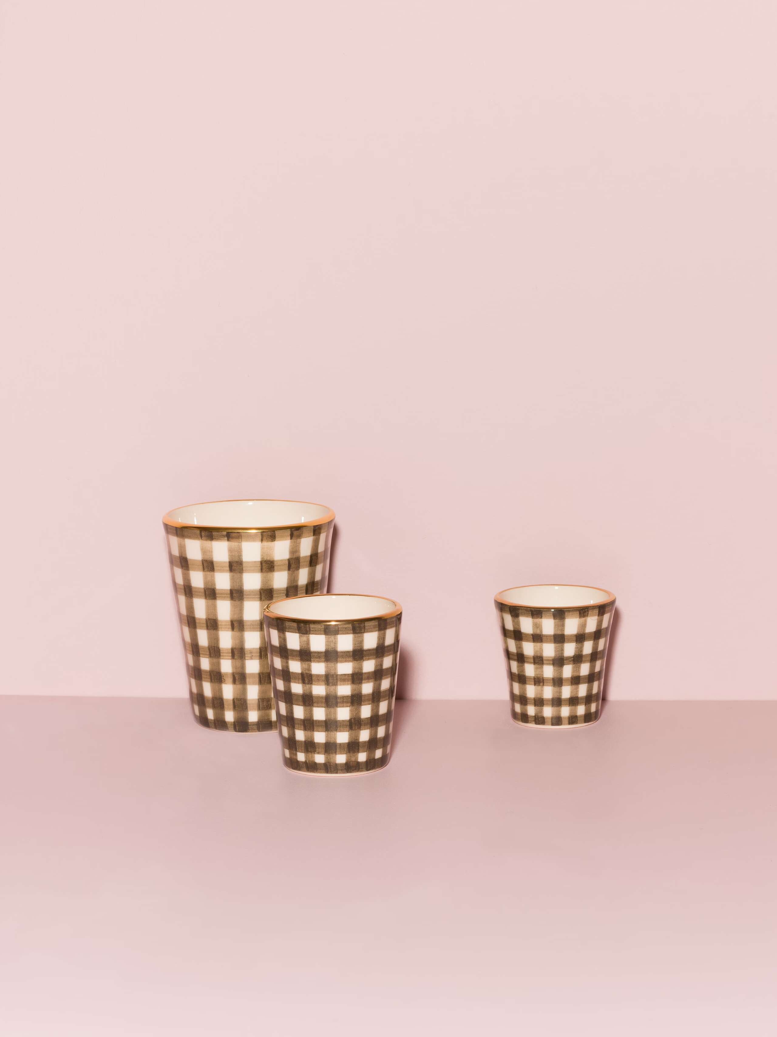 Picture of three beautiful handmade cups in three different sizes featuring a beige vichy check pattern