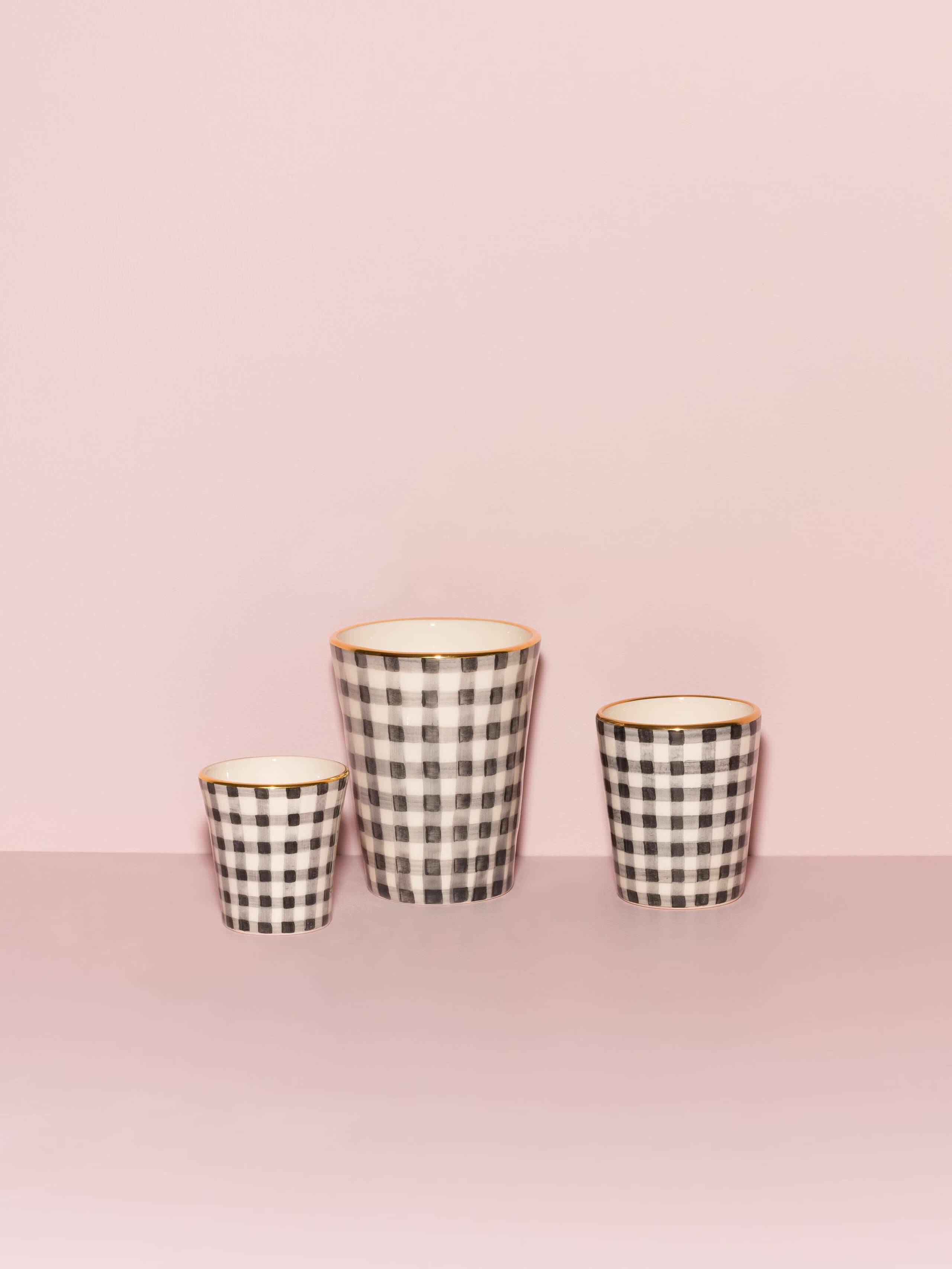 Picture of three beautiful handmade cups in three different sizes featuring a black vichy check pattern