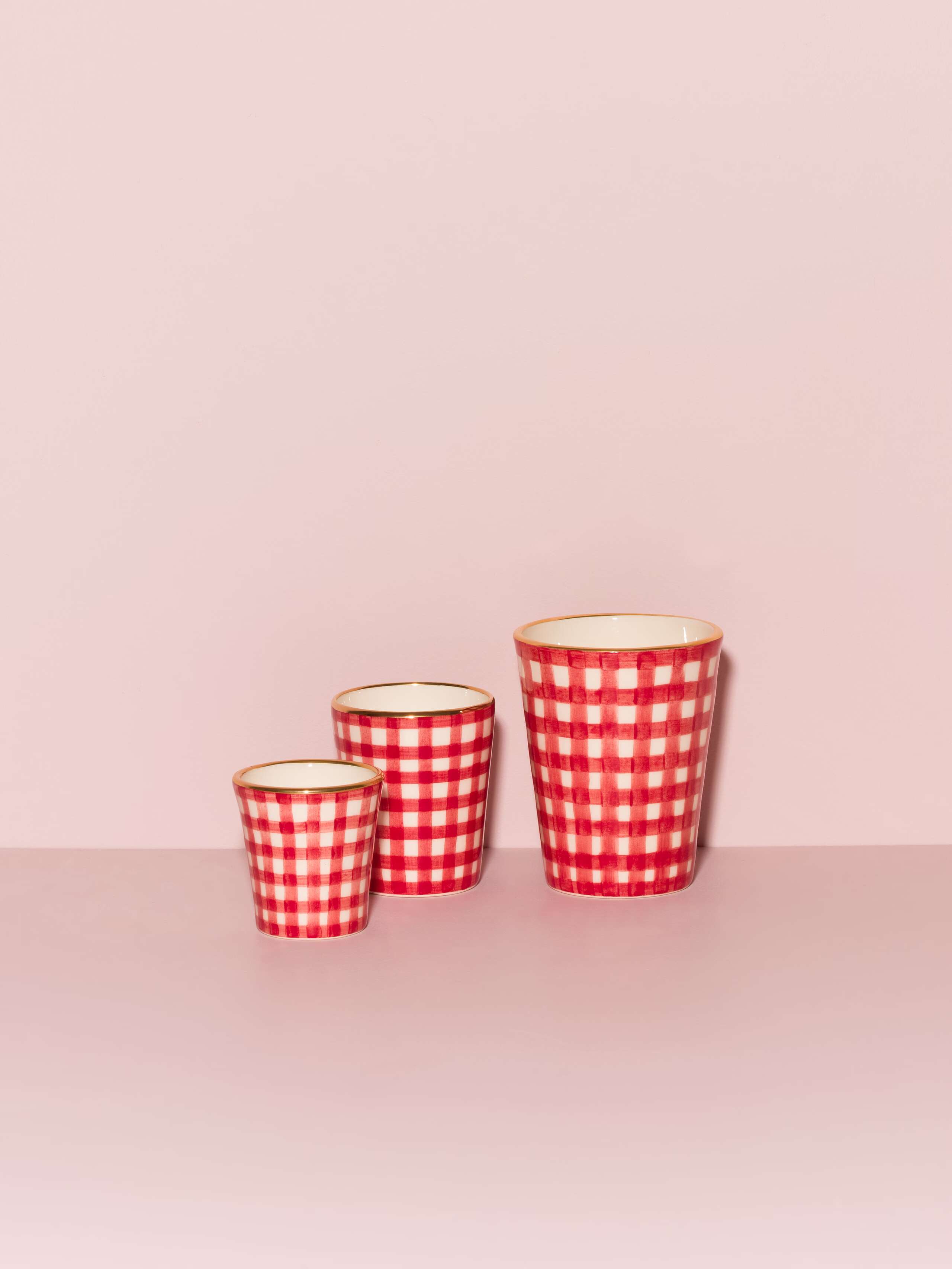 Picture of three beautiful handmade cups in three different sizes featuring a red vichy check pattern