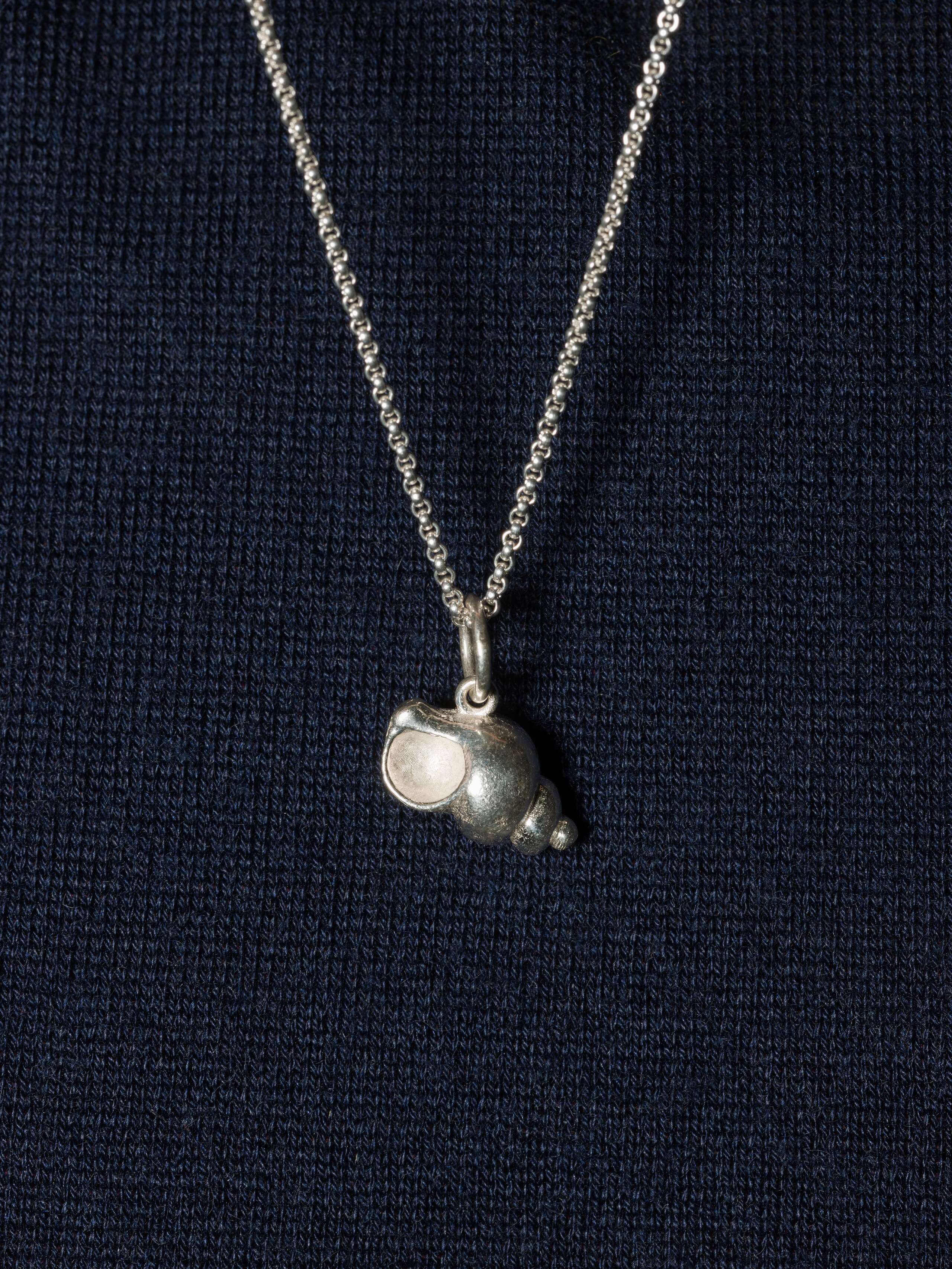 Picture of a shell pendant made of silver