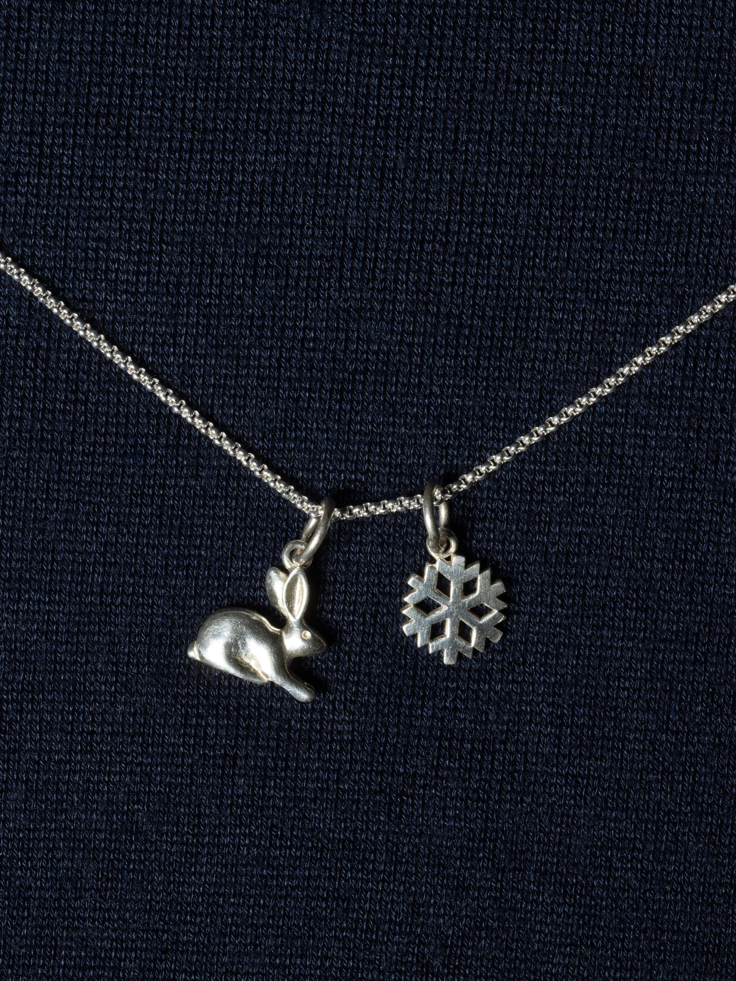 Picture of two beautiful silver pendants (rabbit, snowflake)