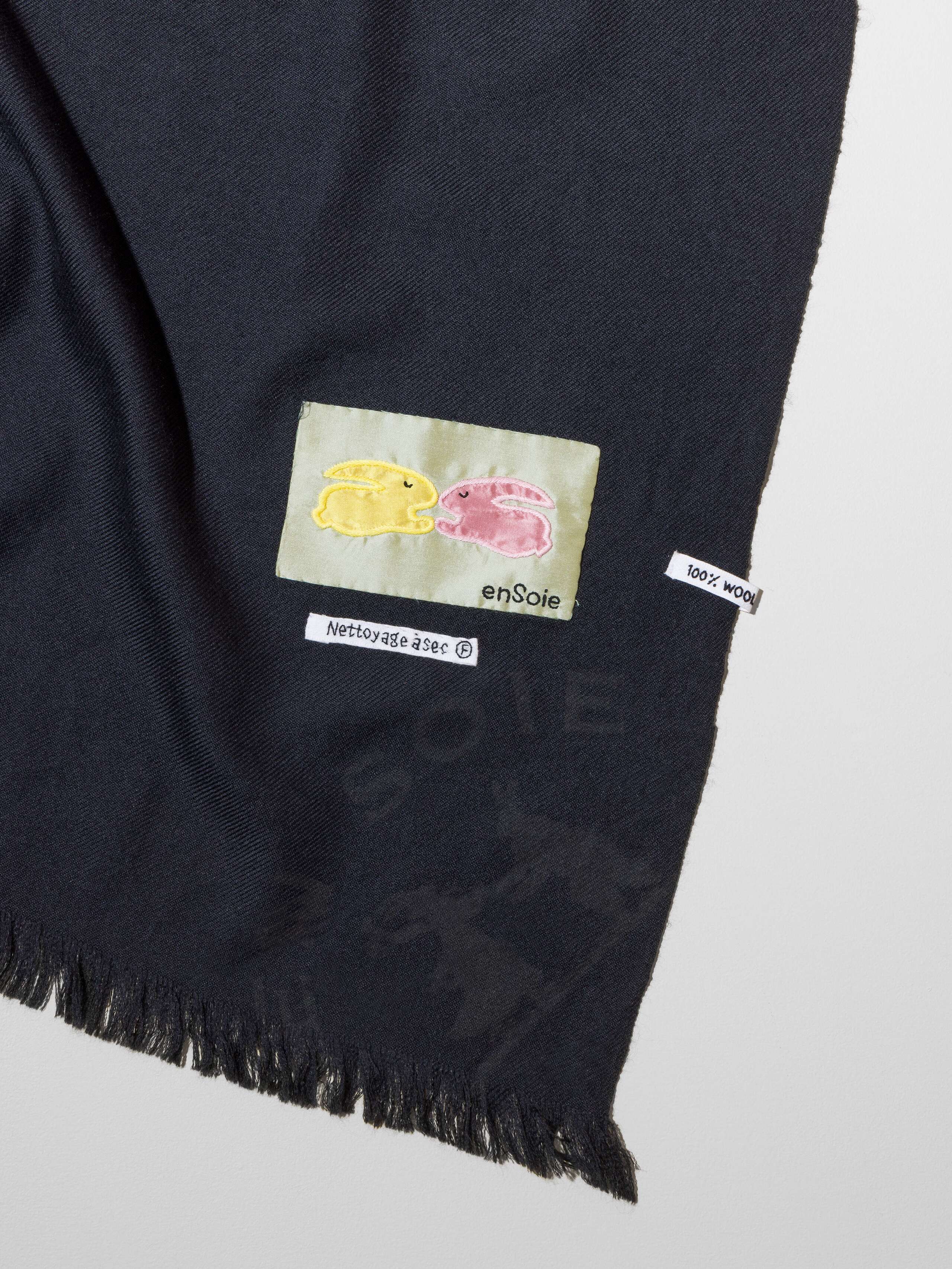 Picture of a detail of a beautiful black wool scarf