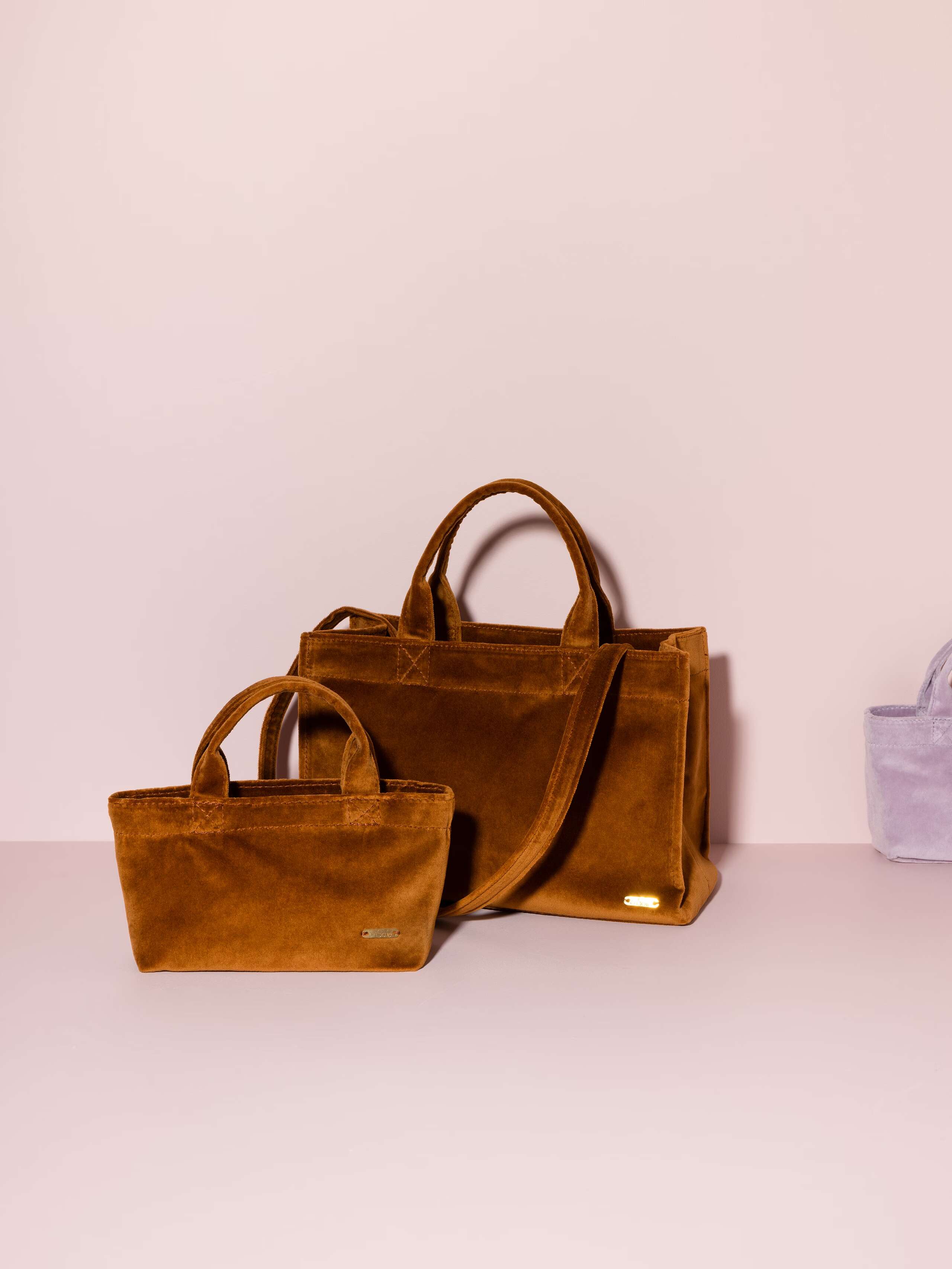 Picture of two handbags made of cognac coloured velvet fabric