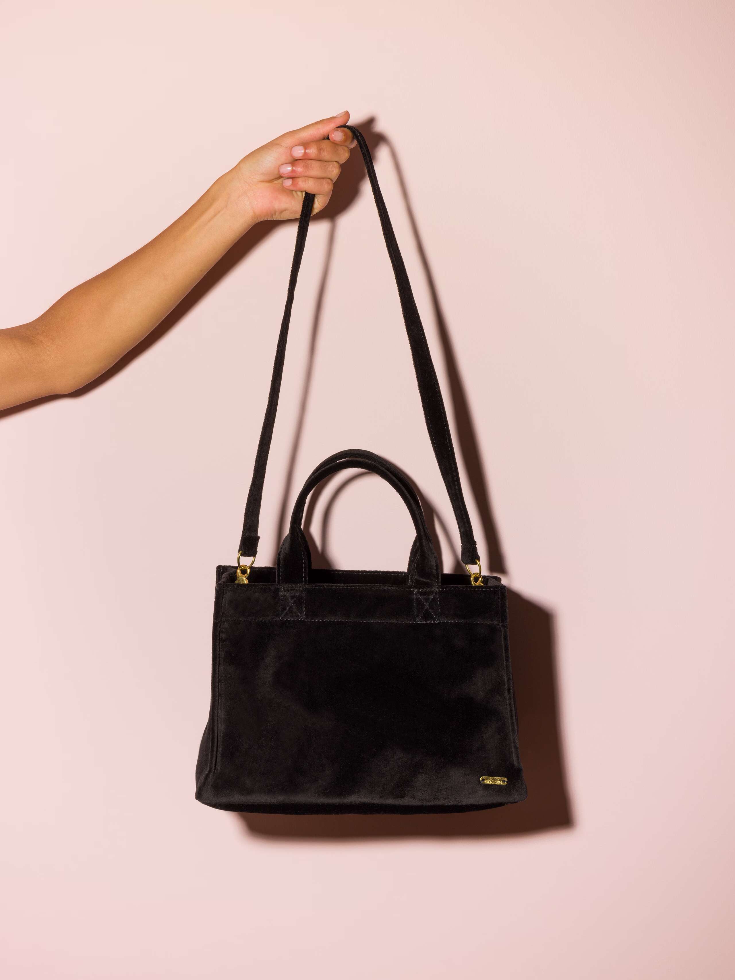 Picture of a black velvet hand bag