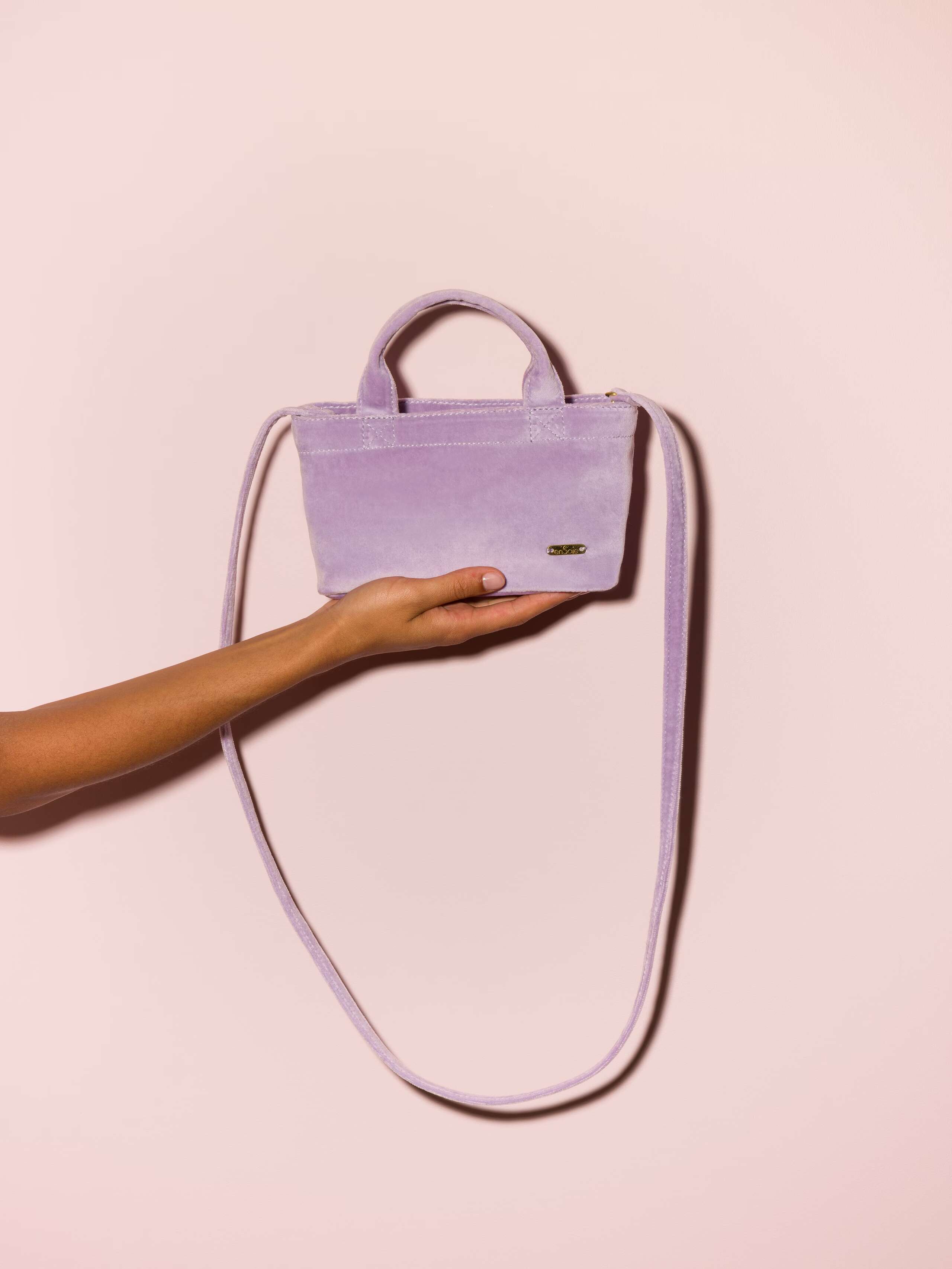 Picture of a lavender micro hand bag made of velvet