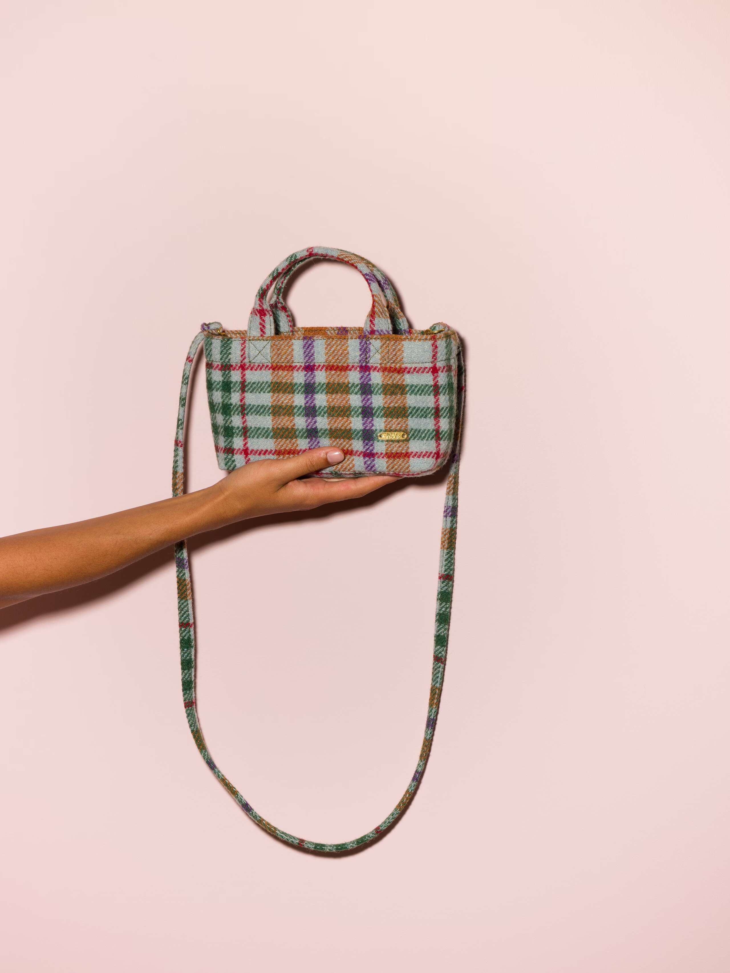 Picture of a micro hand bag in a colourful Harris Tweed fabric
