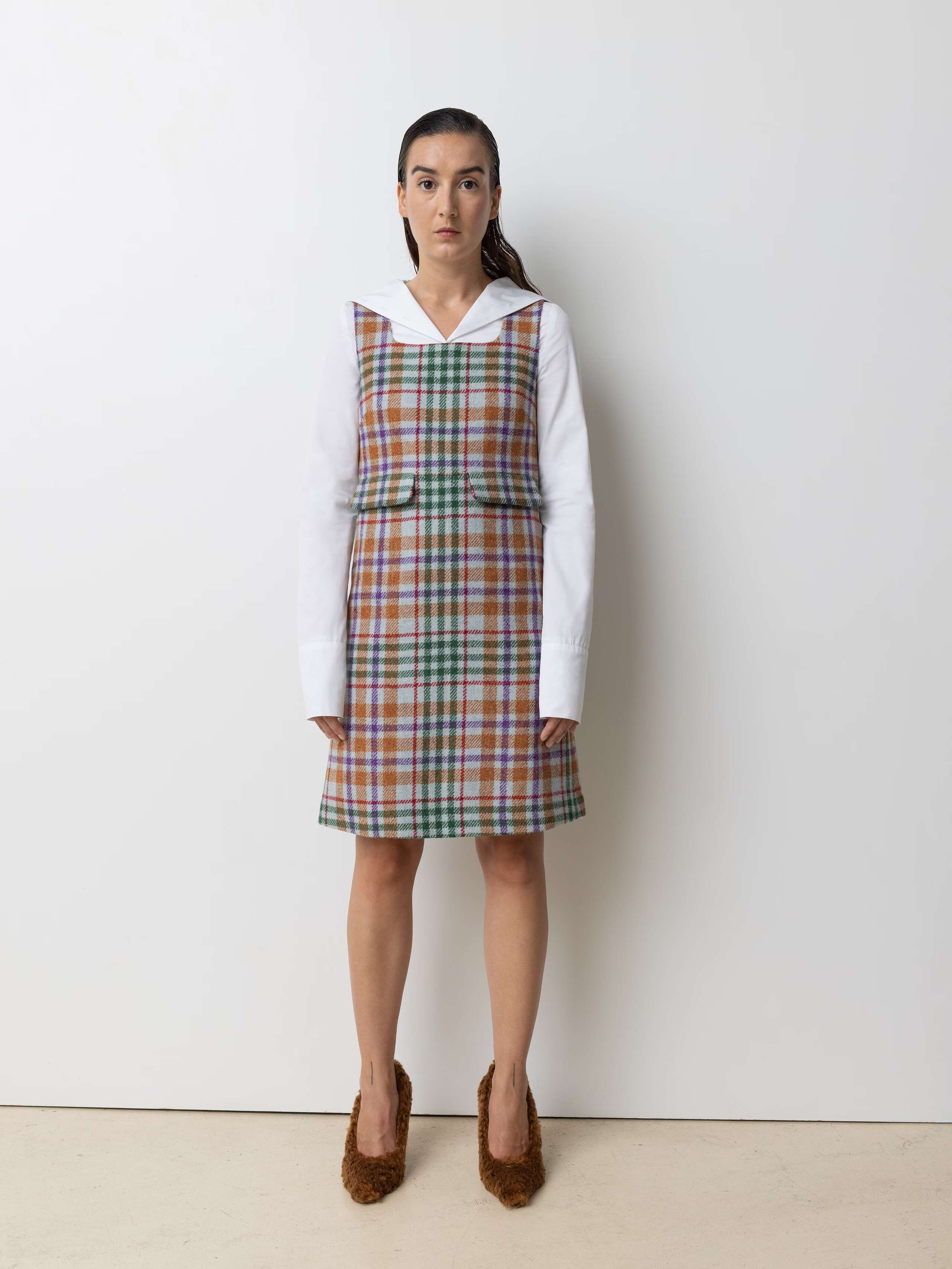 Picture of a female model wearing a colourful dress made from finest Harris Tweed